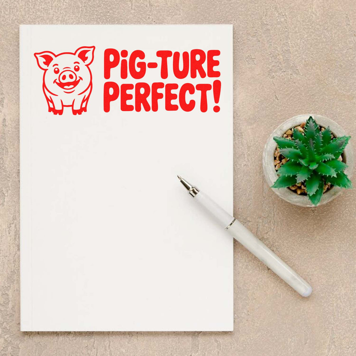 Red pig-ture perfect rubber stamp design on a notepad, ideal for pig-themed card making, journaling, and crafts.