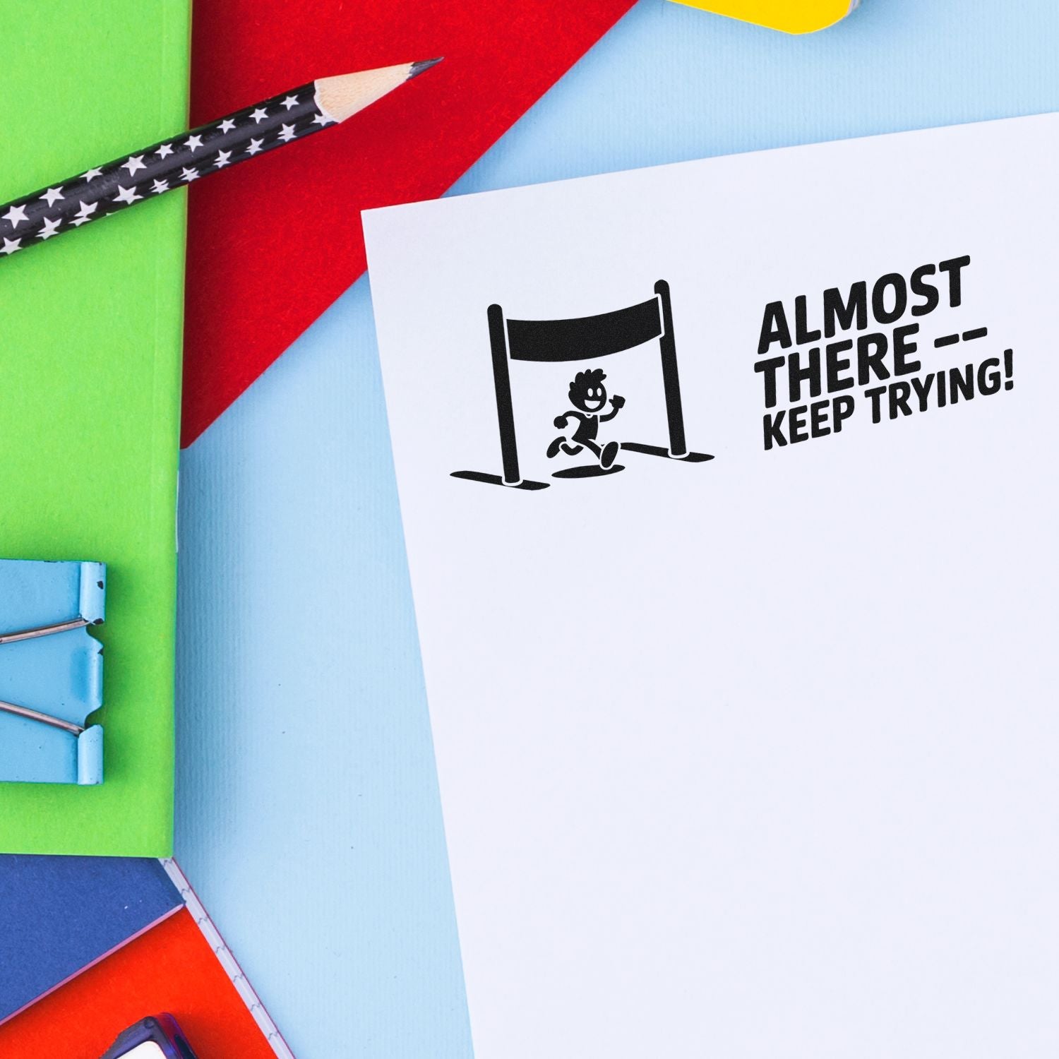 Motivational rubber stamp with Almost ThereKeep Trying! text and runner icon, ideal for encouragement and office use.
