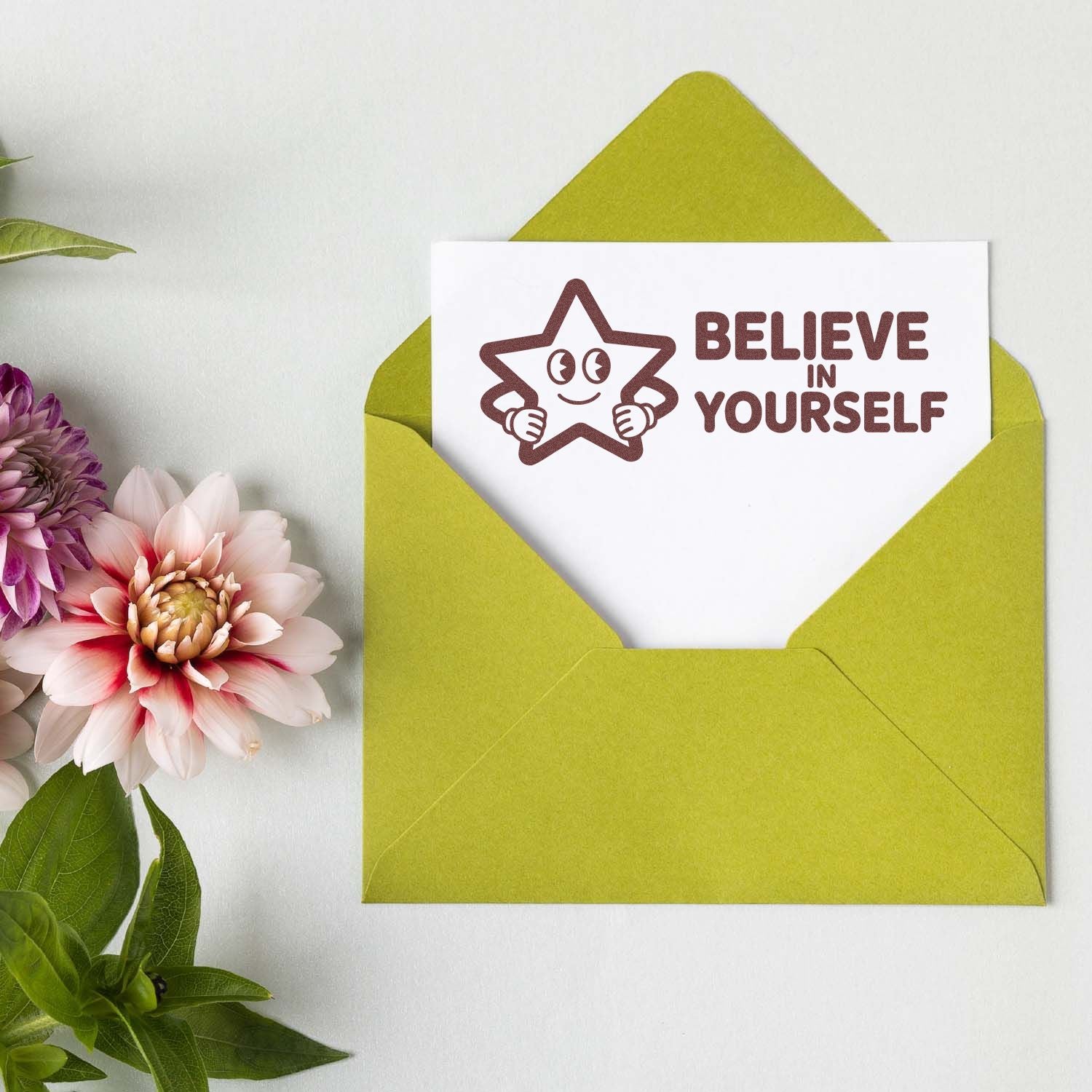 Believe in Yourself rubber stamp on greeting card in green envelope, perfect for motivational handmade cards and paper crafts.