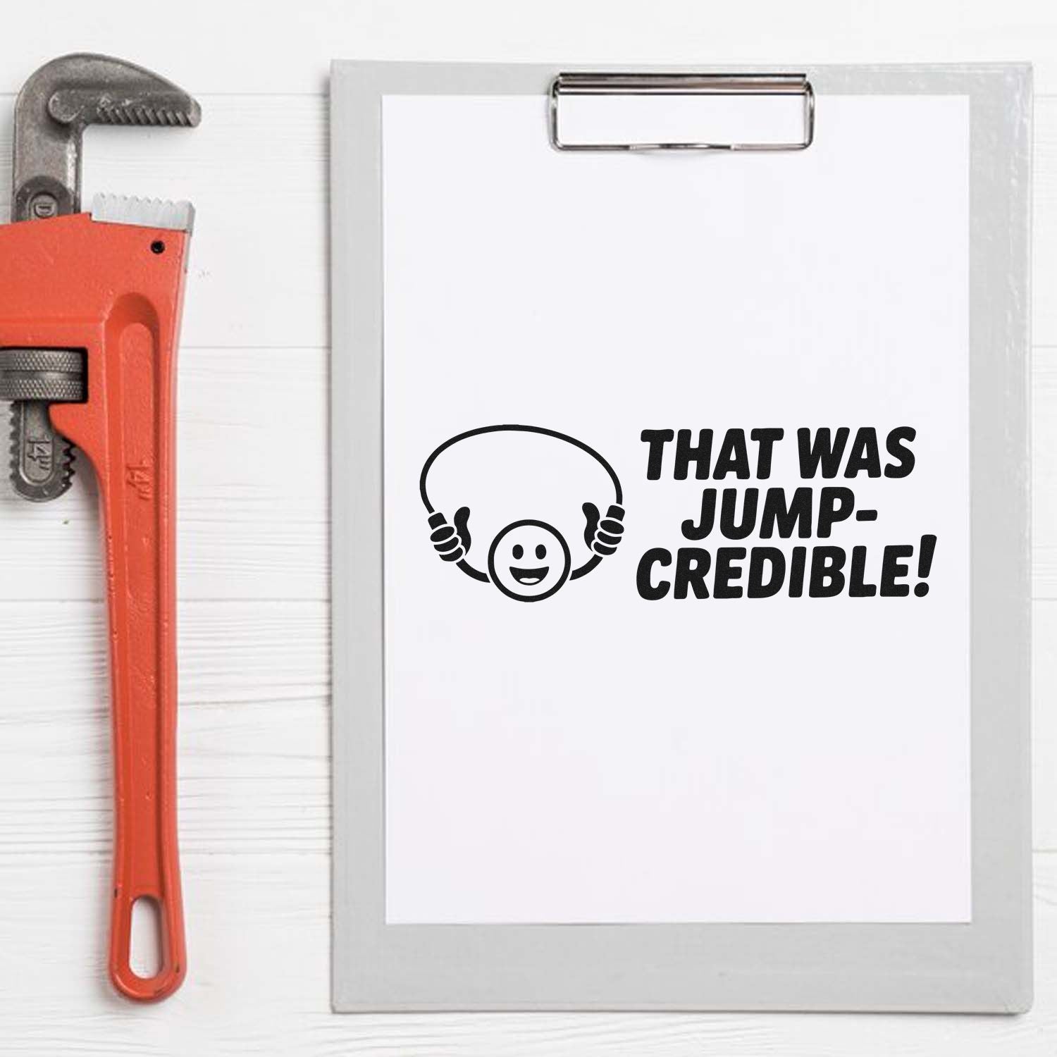 Funny rubber stamp design with That Was Jump-Credible! text, smiling face, and wrench graphic for tool-themed crafts.
