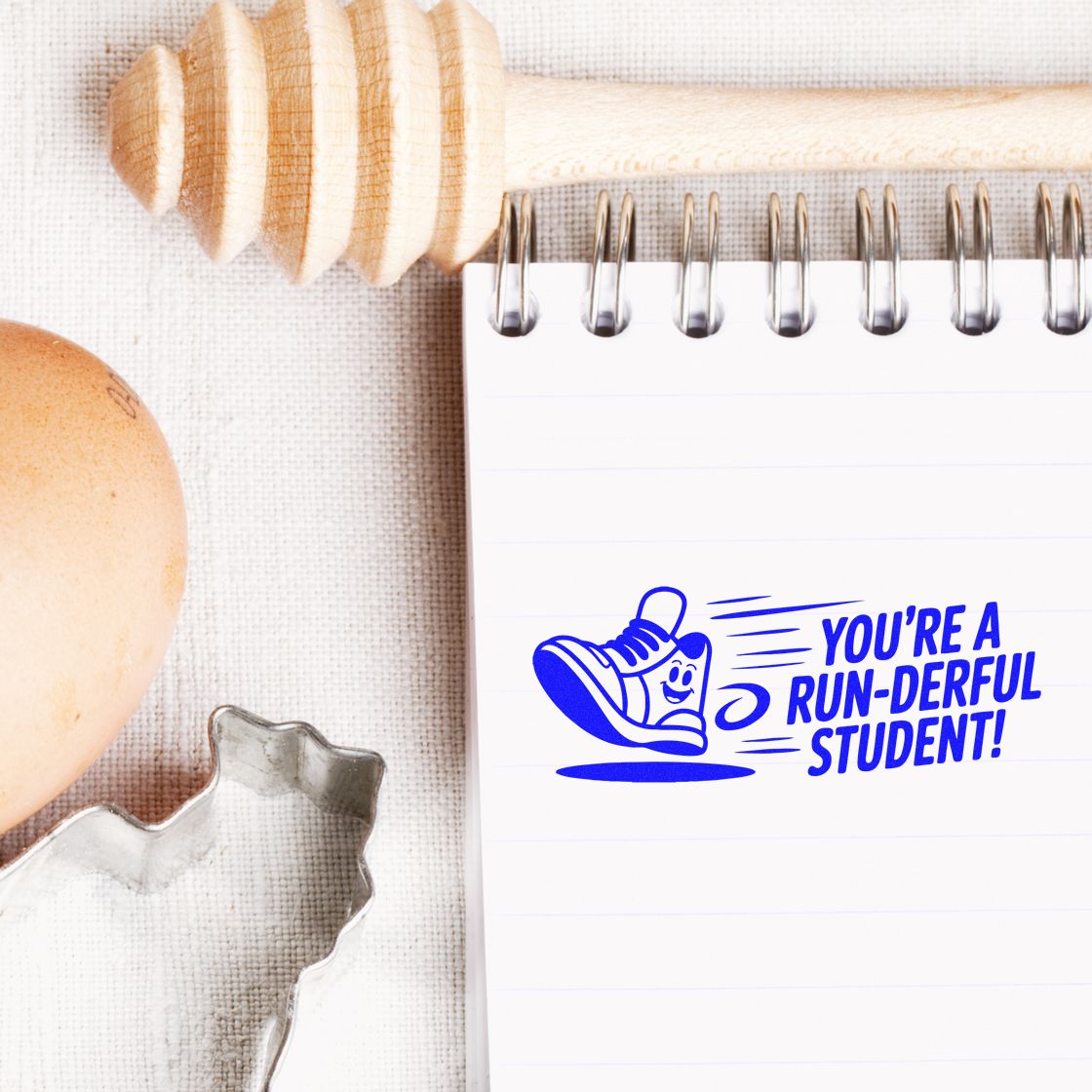 Rubber stamp design reading Youre a run-derful student! with sneaker graphic, ideal for classroom reward stamps and student motivation.