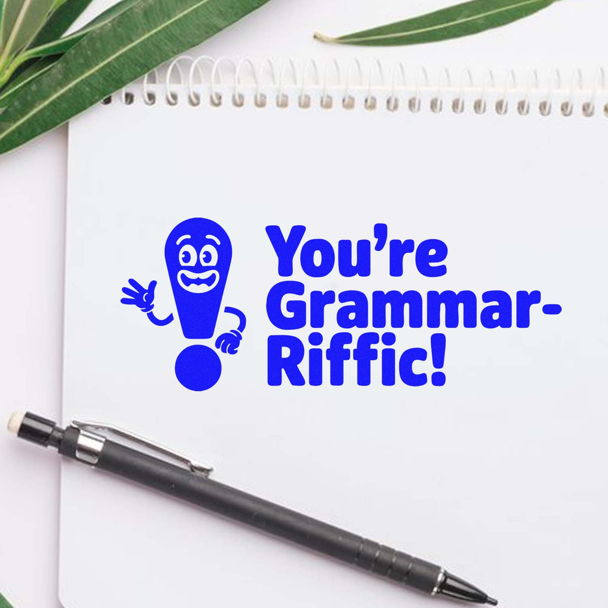 Custom rubber stamp for teachers reading Youre Grammar-Riffic! on notebook, ideal for grading and classroom feedback.