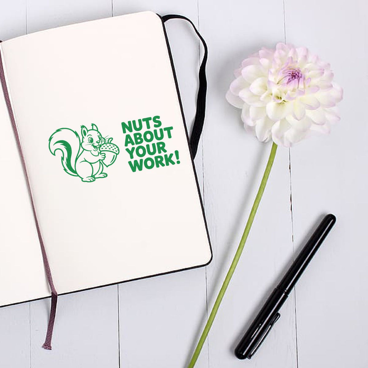 Squirrel Nuts About Your Work rubber stamp design on notebook, perfect for teacher appreciation and office stationery.