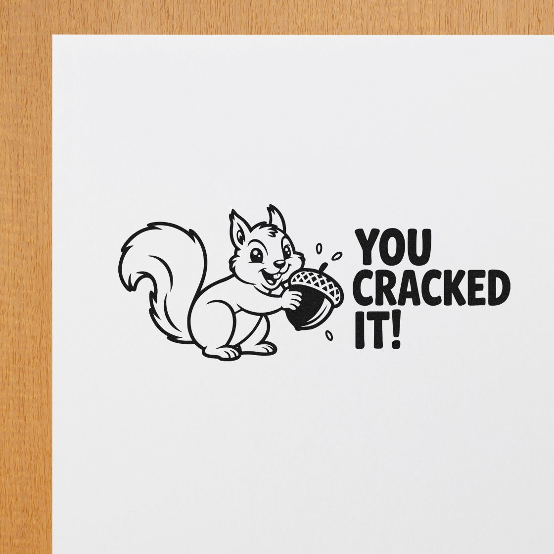 Funny squirrel rubber stamp saying You Cracked It! with acorn, perfect for congratulatory cards, crafts, and handmade projects.