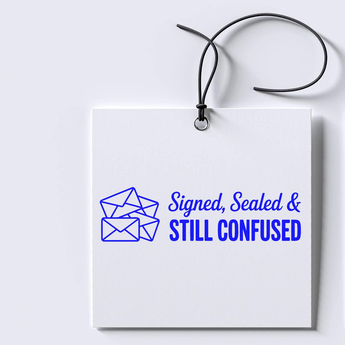 Signed, Sealed & Still Confused custom rubber stamp design with envelope icon on a hanging white card.