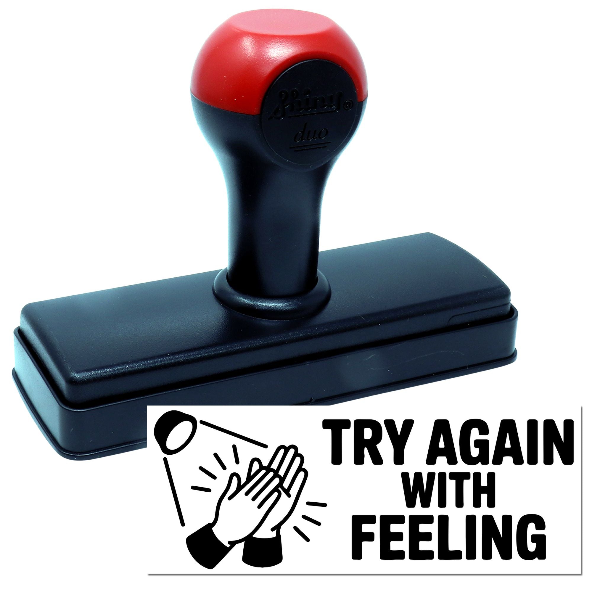 Self-inking rubber stamp with Try Again With Feeling design for office, classroom, or error-correction messaging.