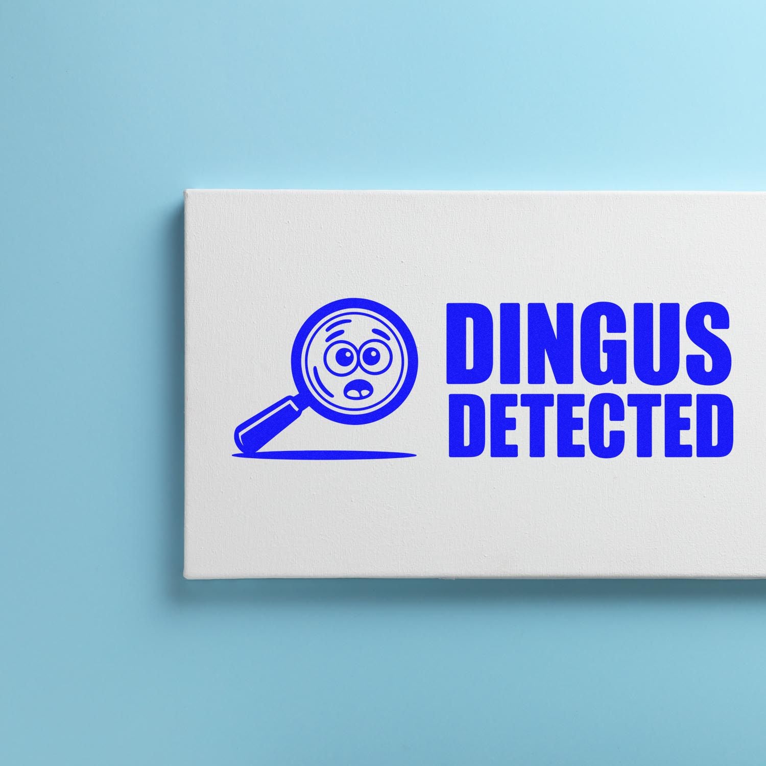 Custom rubber stamp design featuring Dingus Detected and a magnifying glass icon for novelty business or office use.