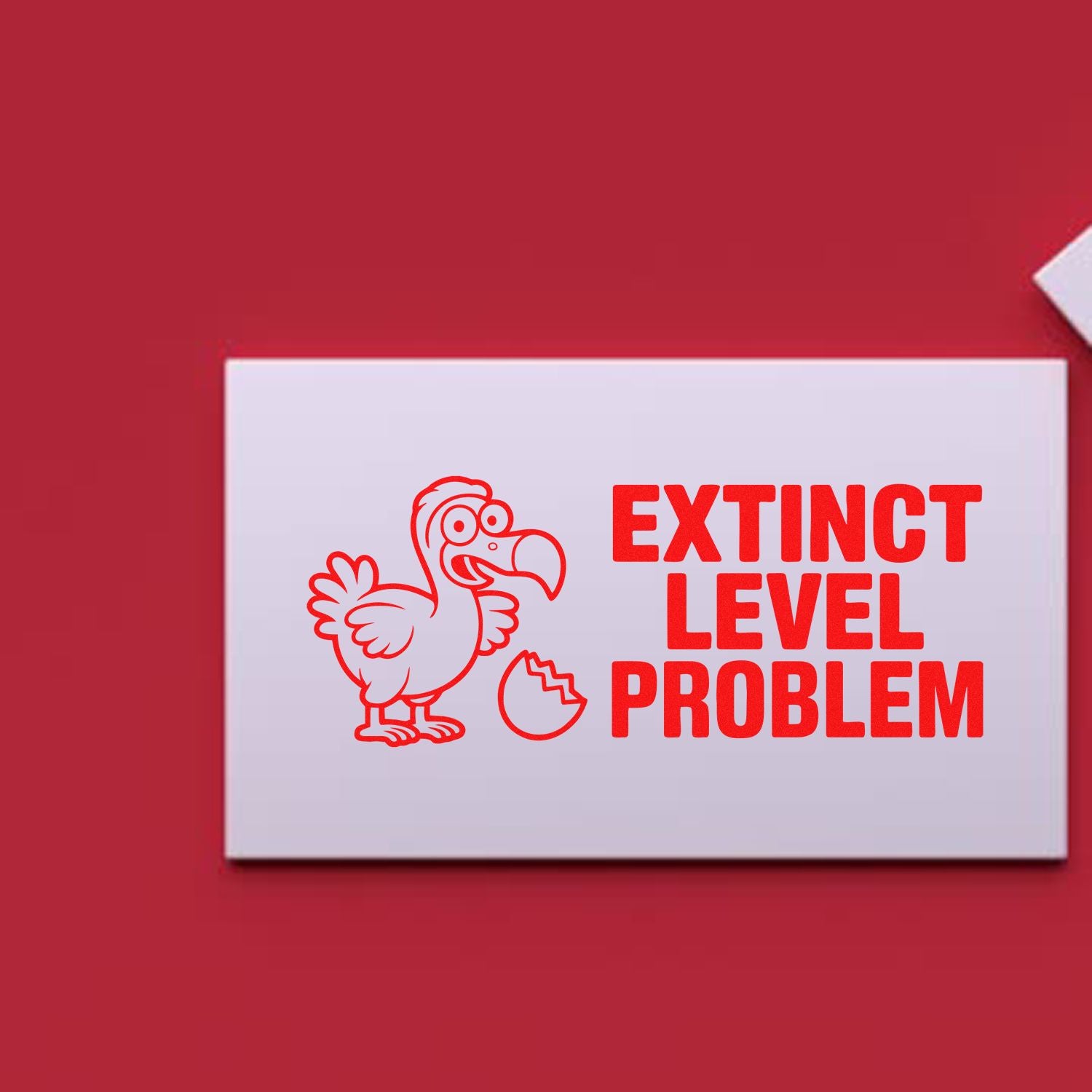 Custom rubber stamp design featuring a dodo and broken egg with the phrase Extinct Level Problem.