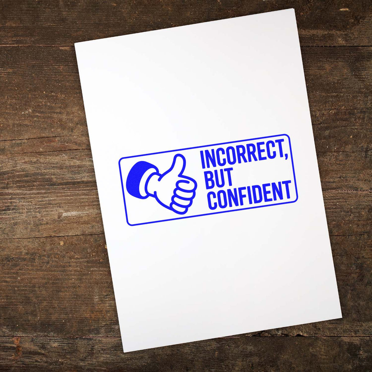 Blue custom rubber stamp design reading Incorrect, but Confident with thumbs-up icon on white paper.