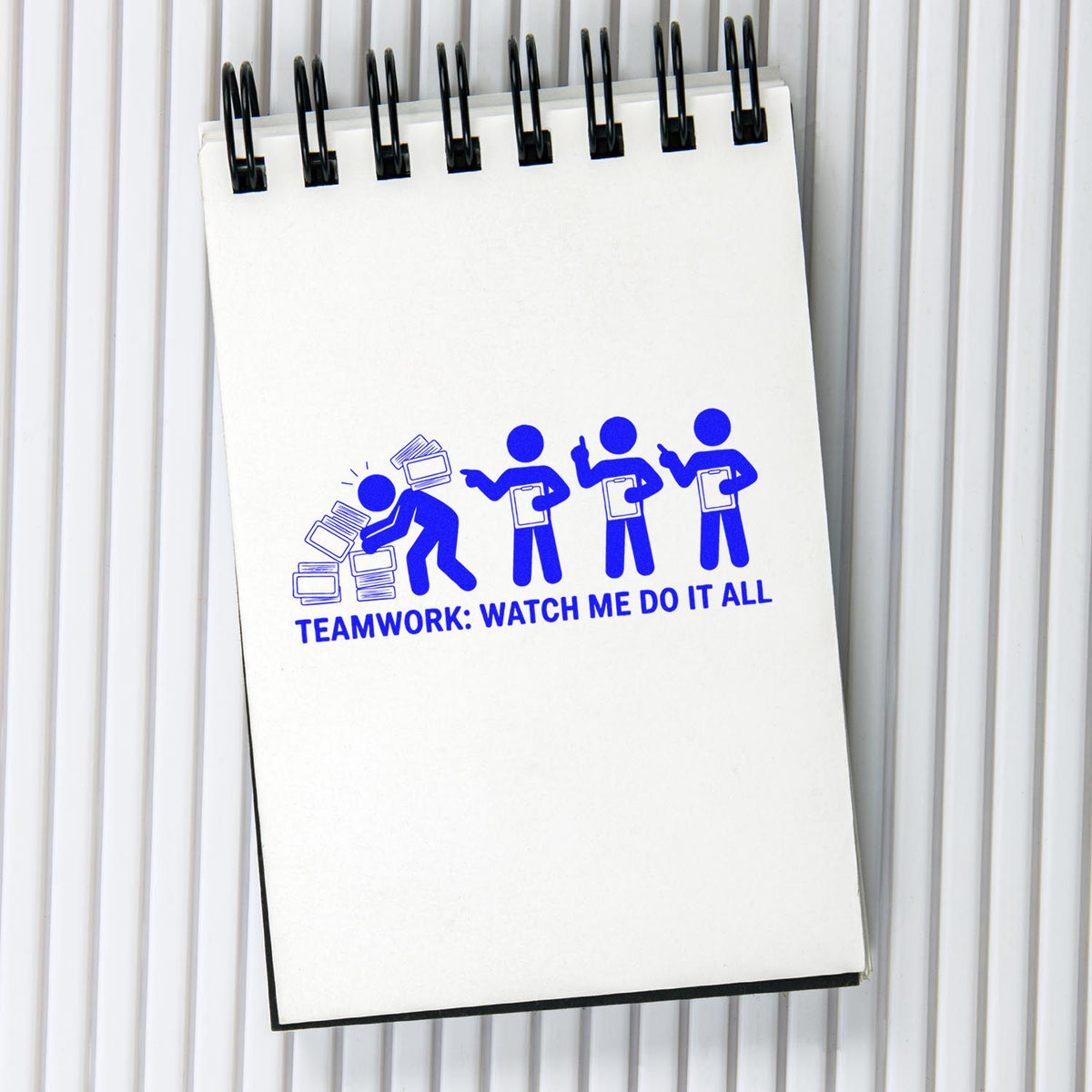 Custom rubber stamp design with teamwork cartoon and slogan Watch Me Do It All for office humor.