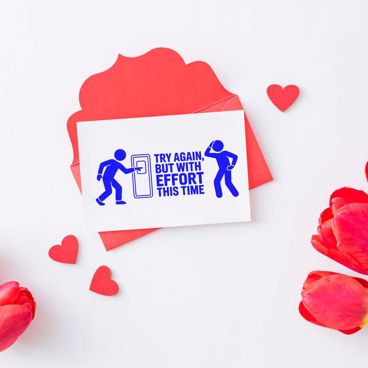 Motivational rubber stamp design reading Try Again, But With Effort This Time for playful teacher or office feedback.