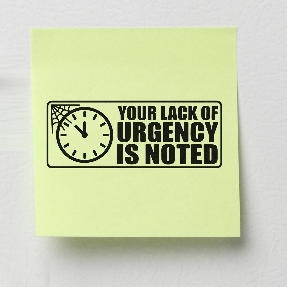 Humorous rubber stamp design on sticky note reading Your Lack of Urgency Is Noted with clock icon.