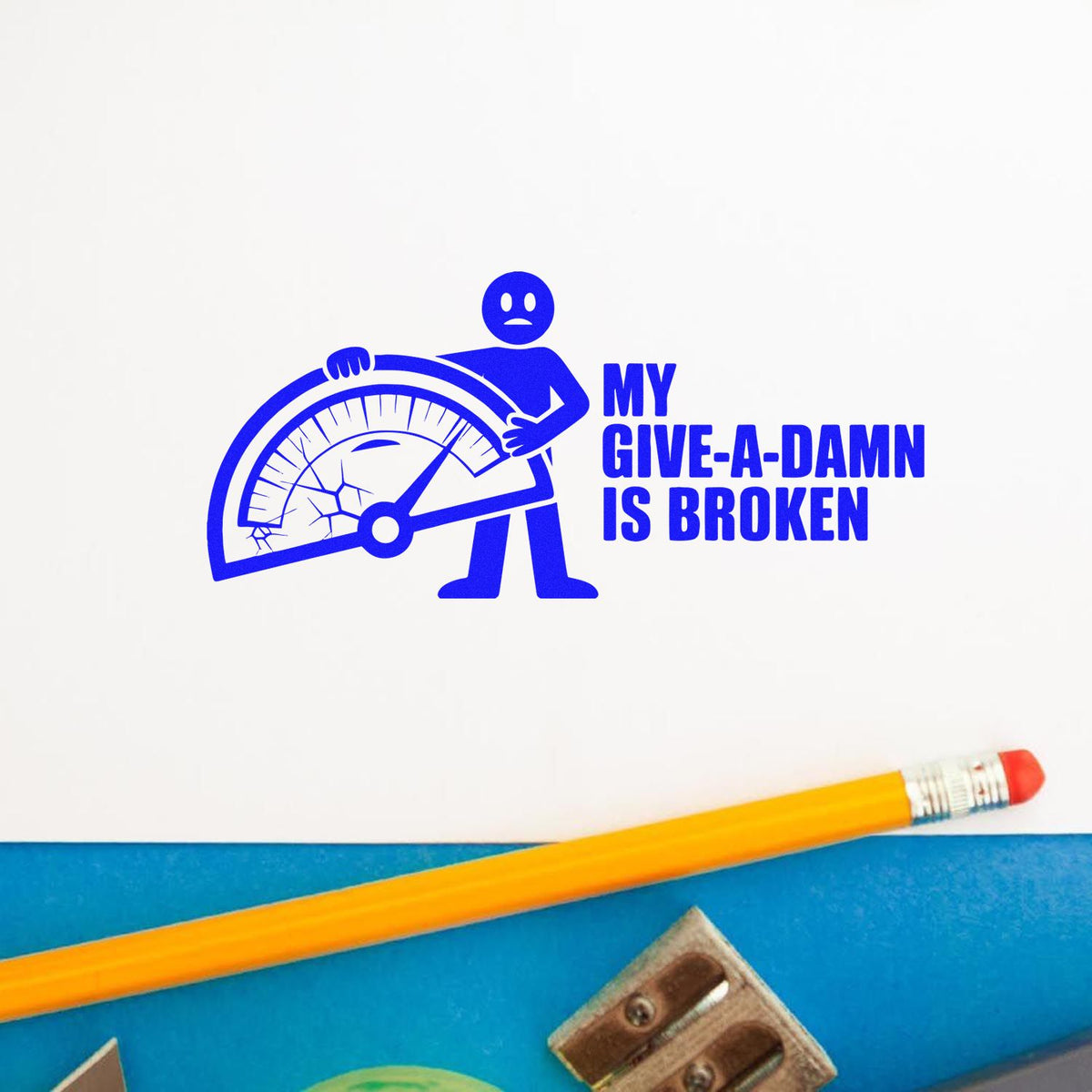 Blue novelty rubber stamp impression reading My Give-a-Damn Is Broken with broken gauge design for office humor.