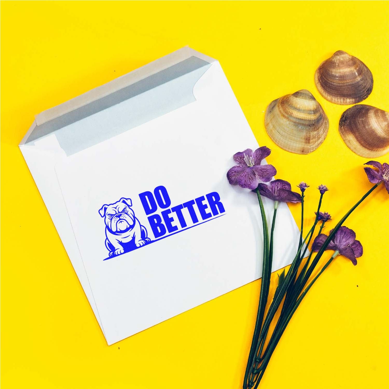 Custom bulldog rubber stamp design on a white envelope with Do Better slogan for branded packaging and mailers.