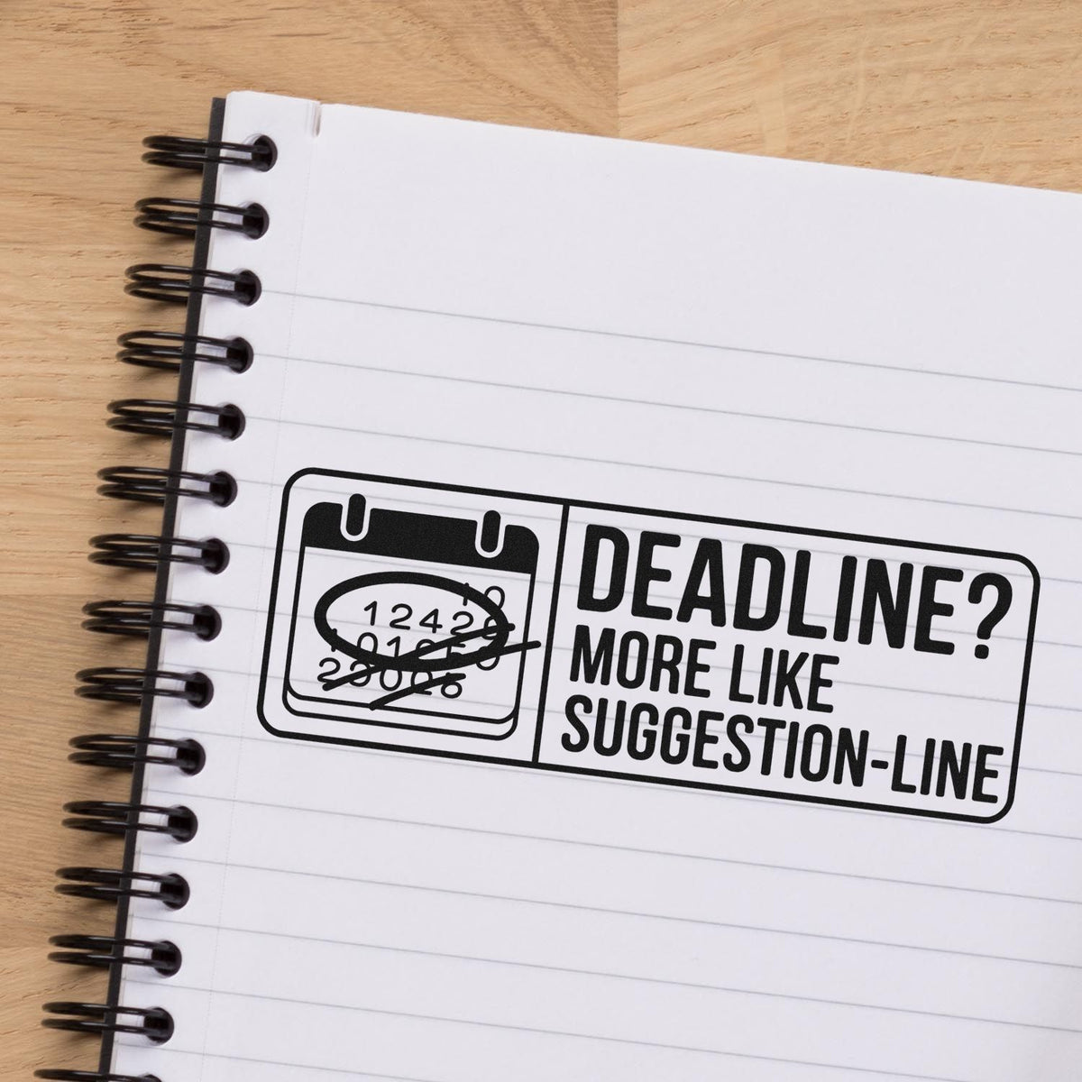 Humorous deadline rubber stamp design on notebook, saying Deadline? More like suggestion-line for office and planner use.