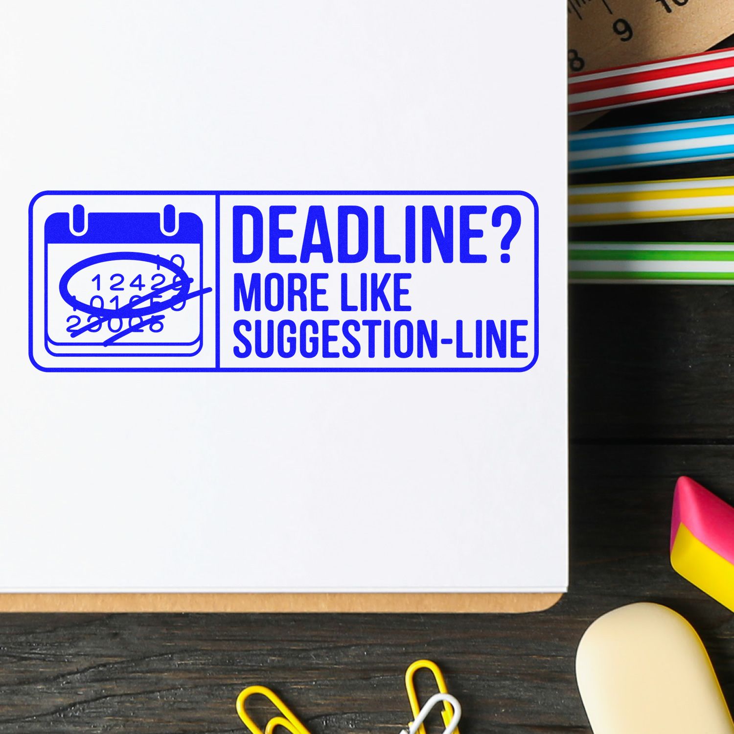 Blue rubber stamp with crossed-out calendar and Deadline? More like suggestion-line office humor on paper.