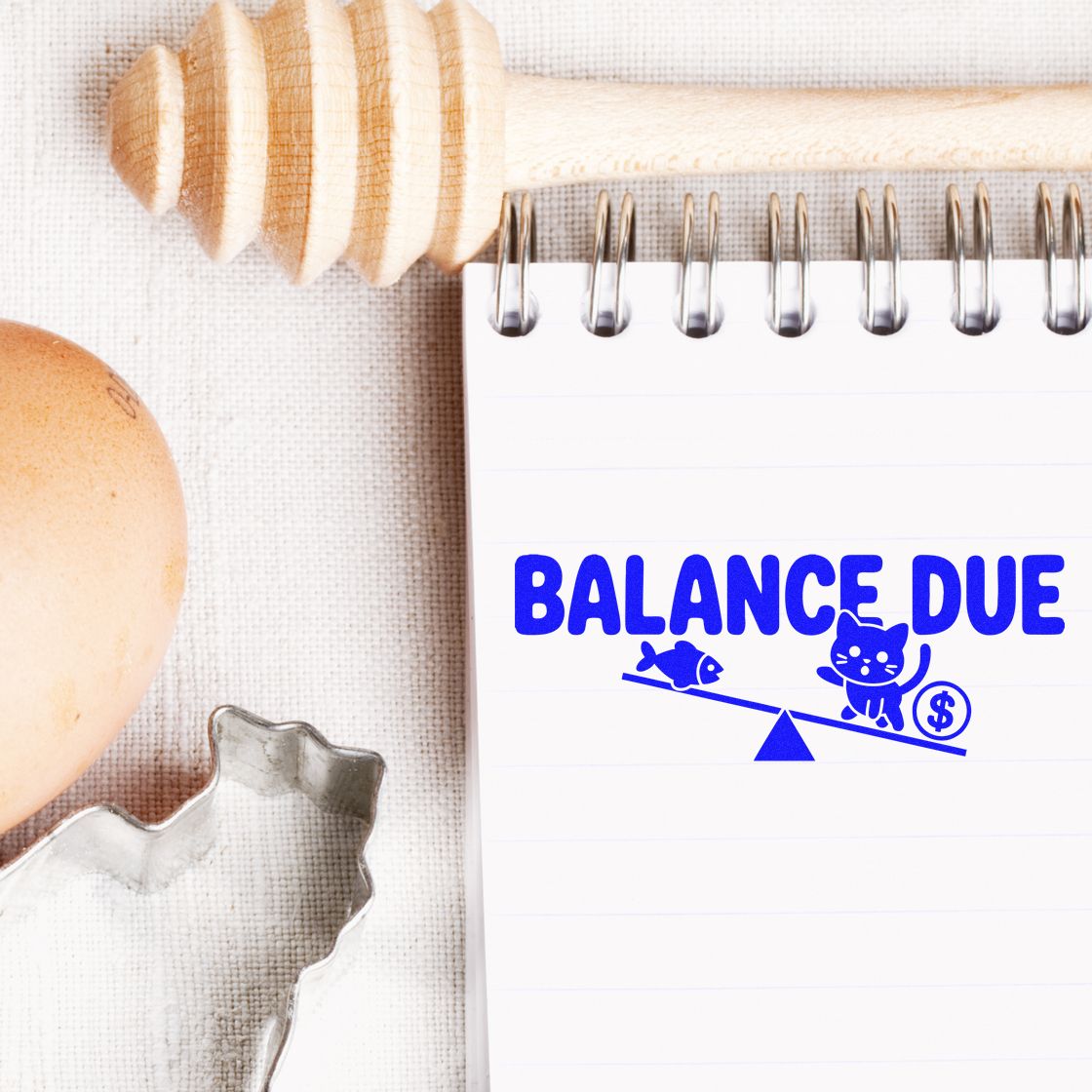 Balance Due rubber stamp on notebook for invoices, payment reminders, and accounting records