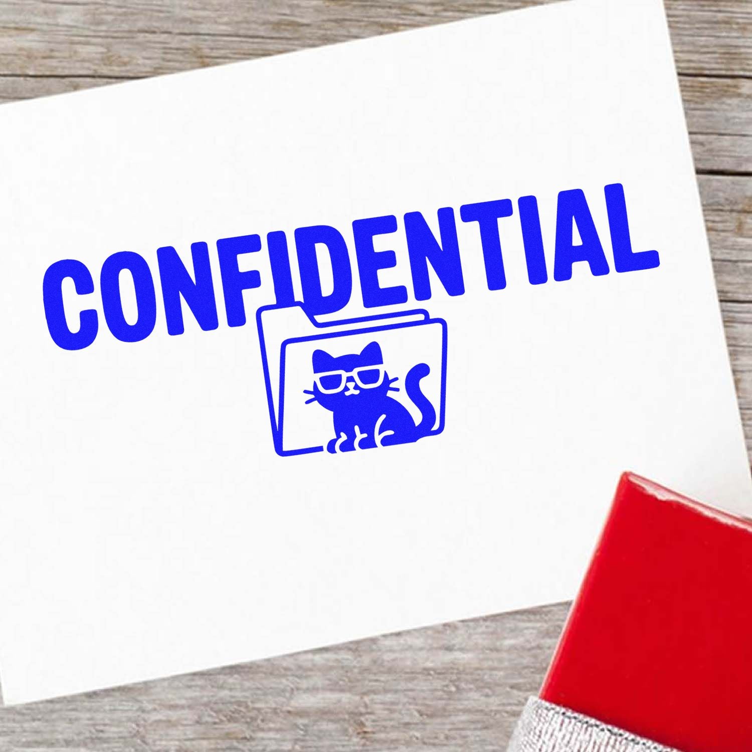 Confidential rubber stamp with cat-in-folder icon for marking secure office documents and sensitive mail.