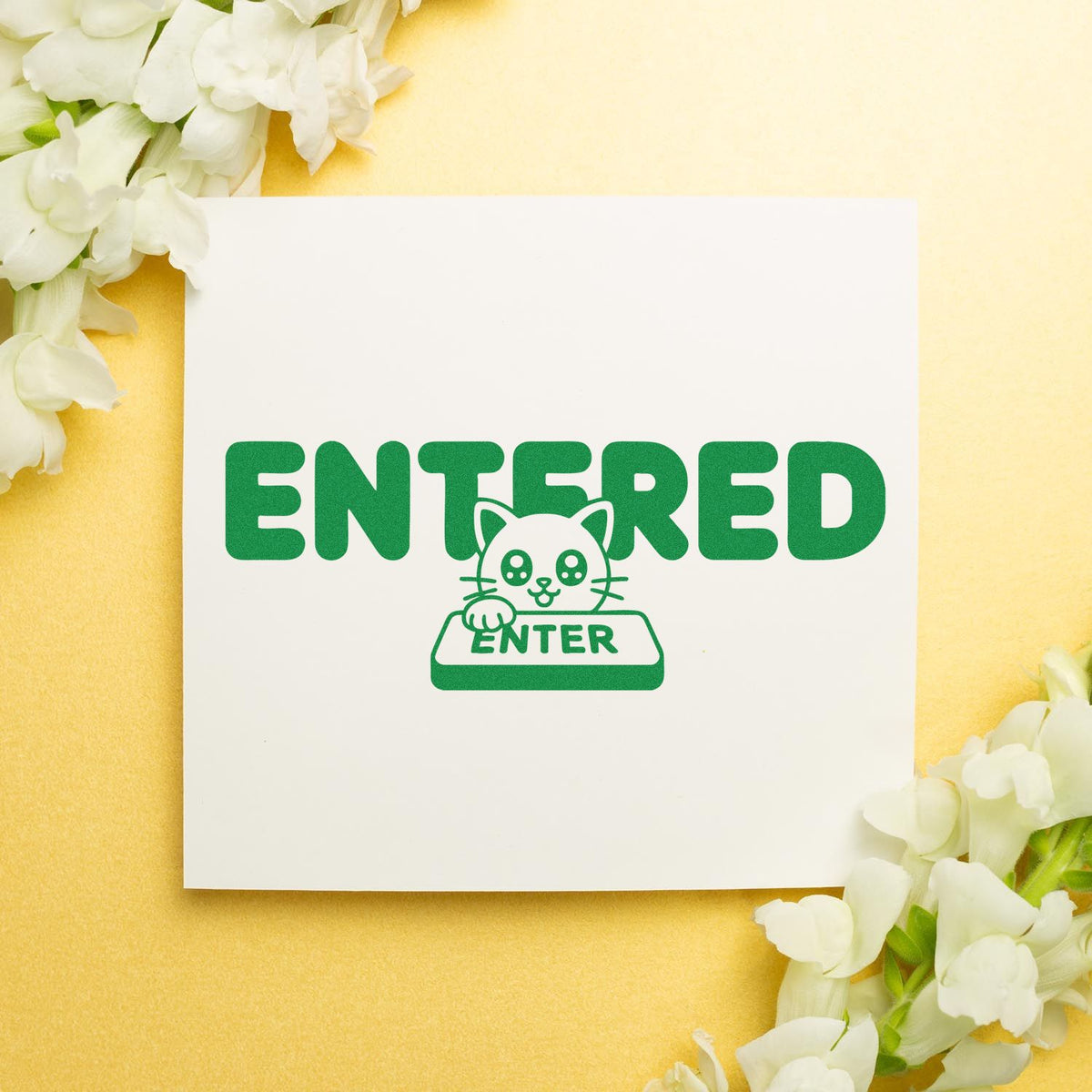 Entered rubber stamp design with cute cat pressing enter key, green office approval stamp on yellow floral background