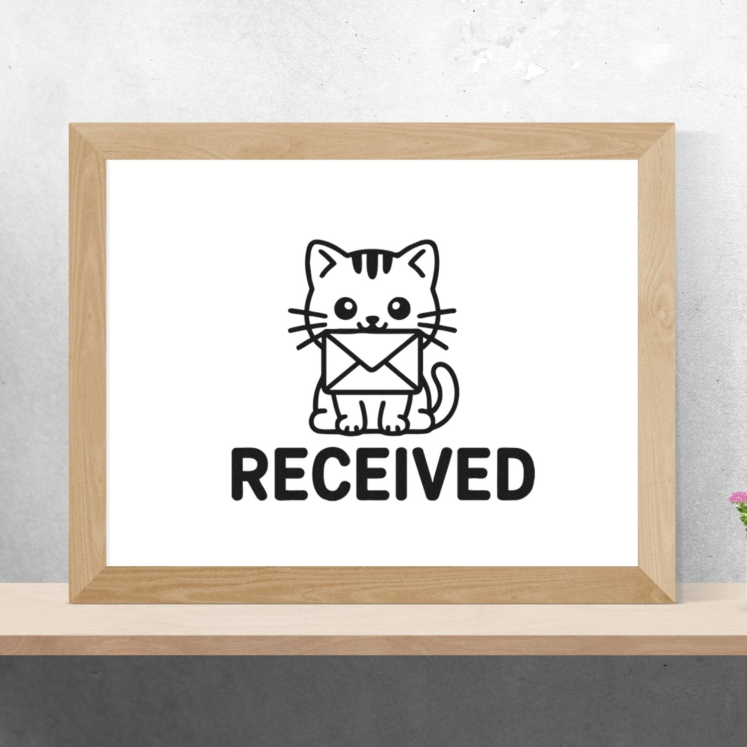 Cute cat holding envelope received rubber stamp for office mail, packages, and document processing.