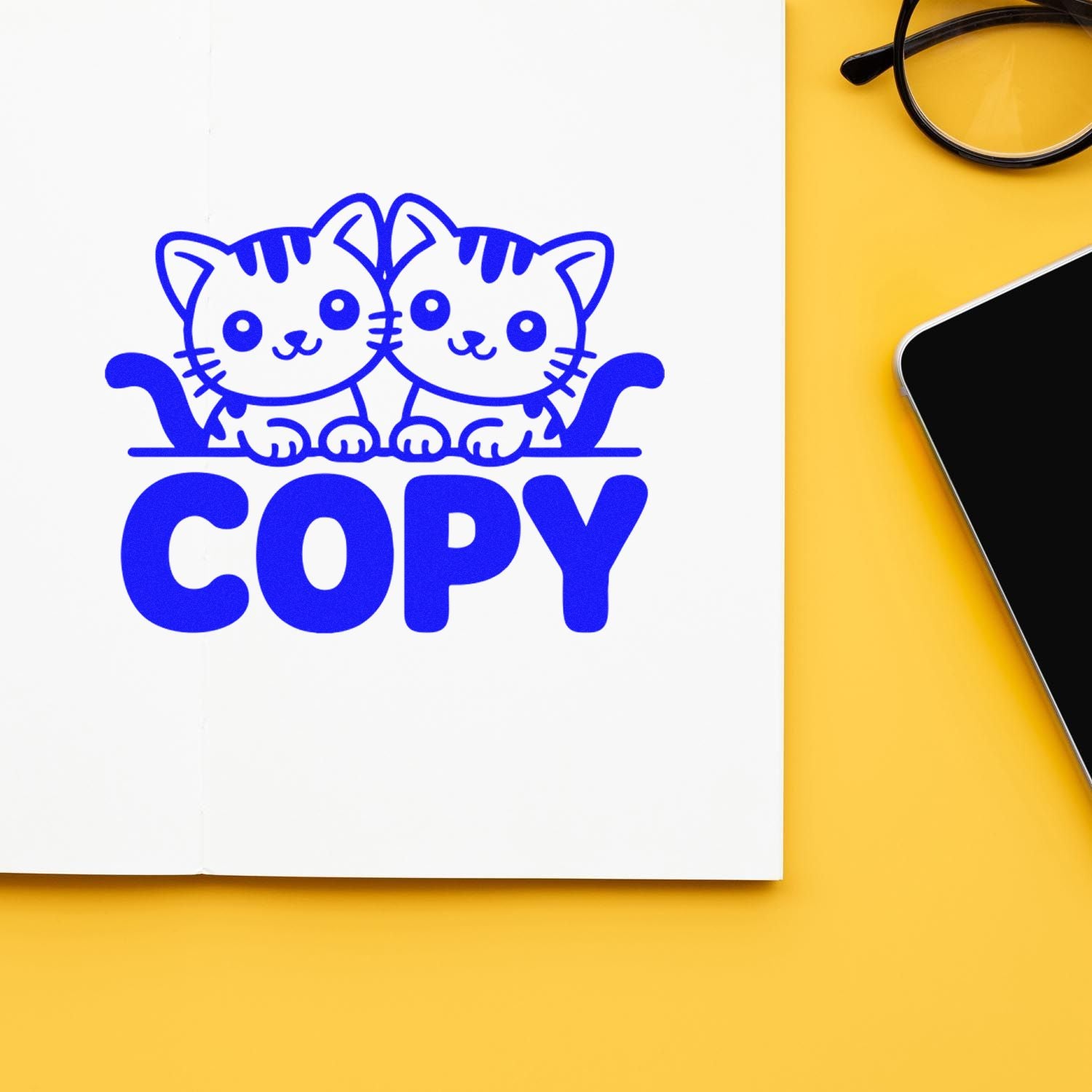 Cat-themed copy rubber stamp design with two kittens above bold COPY text for office documents and stationery.