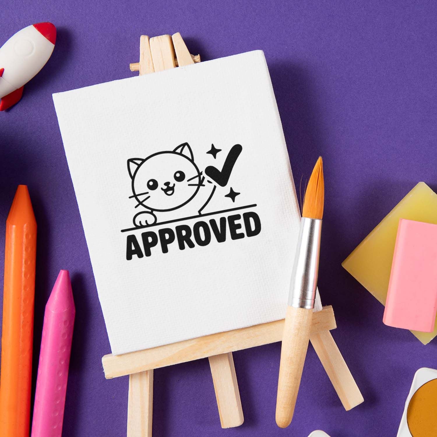 Cute cat APPROVED rubber stamp design on mini easel, perfect for crafting, stationery, and teacher feedback stamps.