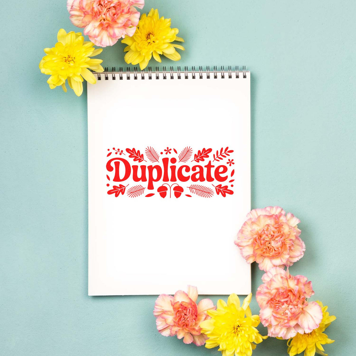 Decorative Duplicate rubber stamp design on a notebook page, framed by flowers, for office and craft labeling.