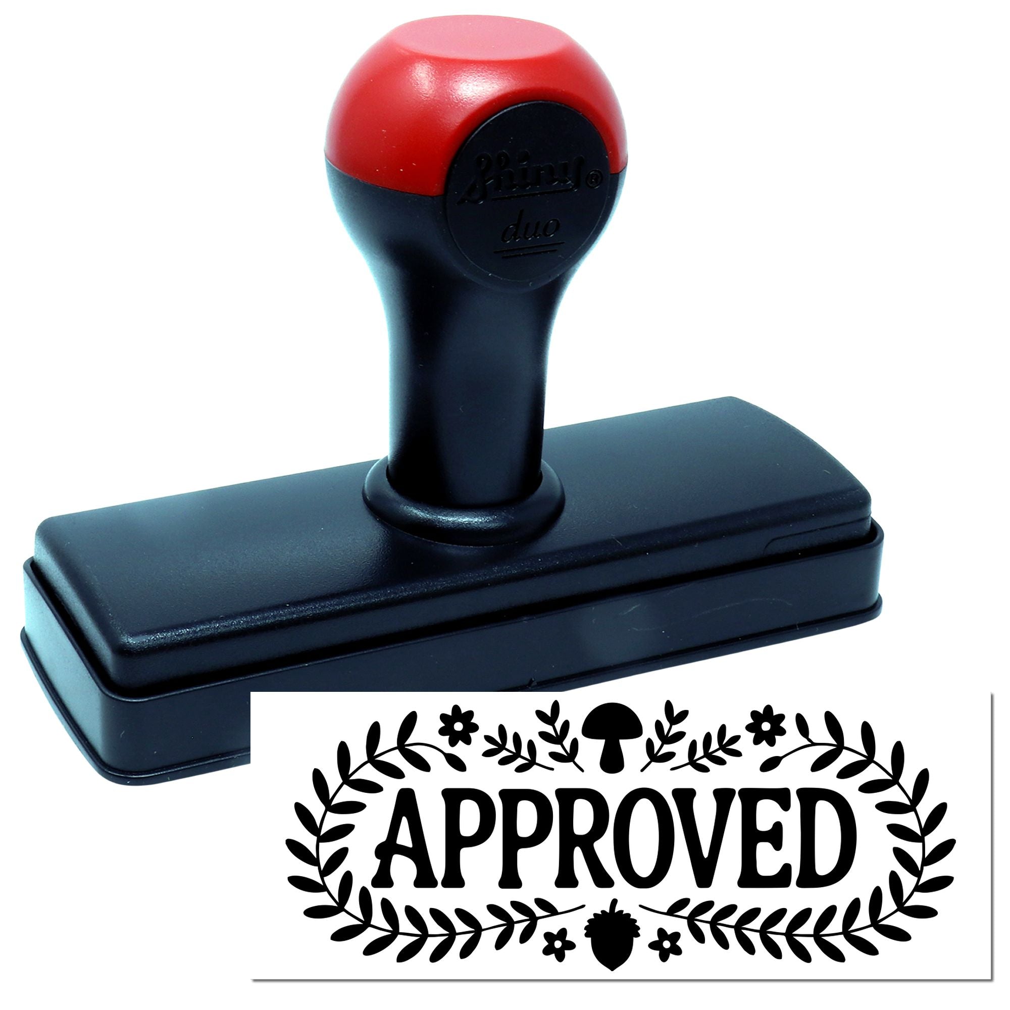 Self-inking rubber approved stamp with floral border, showing bold APPROVED impression for office and business use.