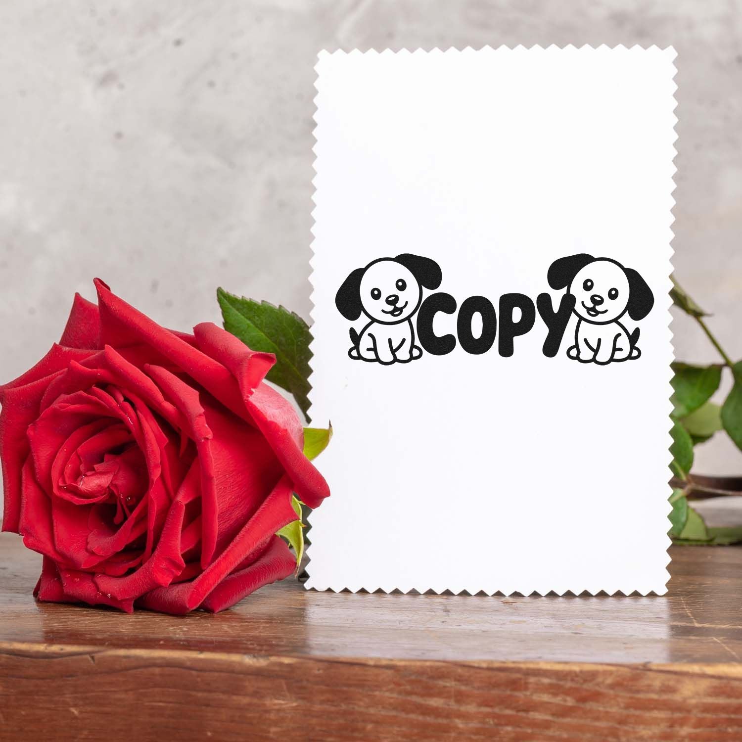 Cute puppy copy rubber stamp on white card, ideal for handmade stationery, craft projects, and small business branding.