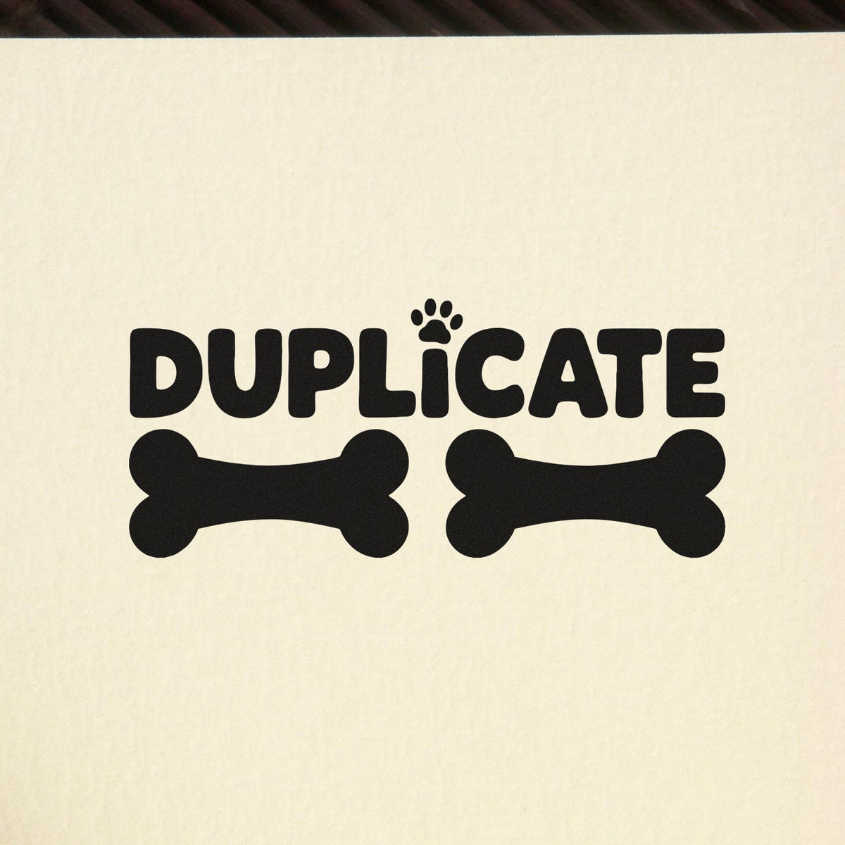 Pet-themed duplicate rubber stamp with paw print and bone icons for marking copies.