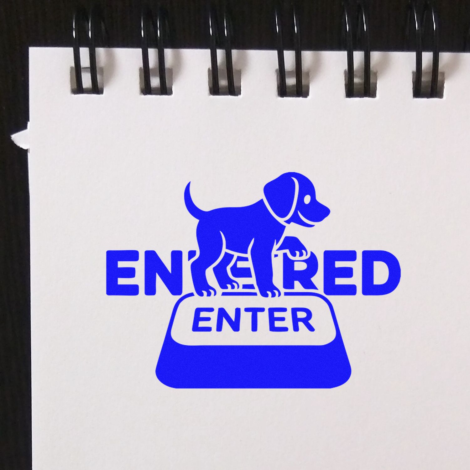 Blue dog-themed ENTERED rubber stamp design for marking documents and office files as received.