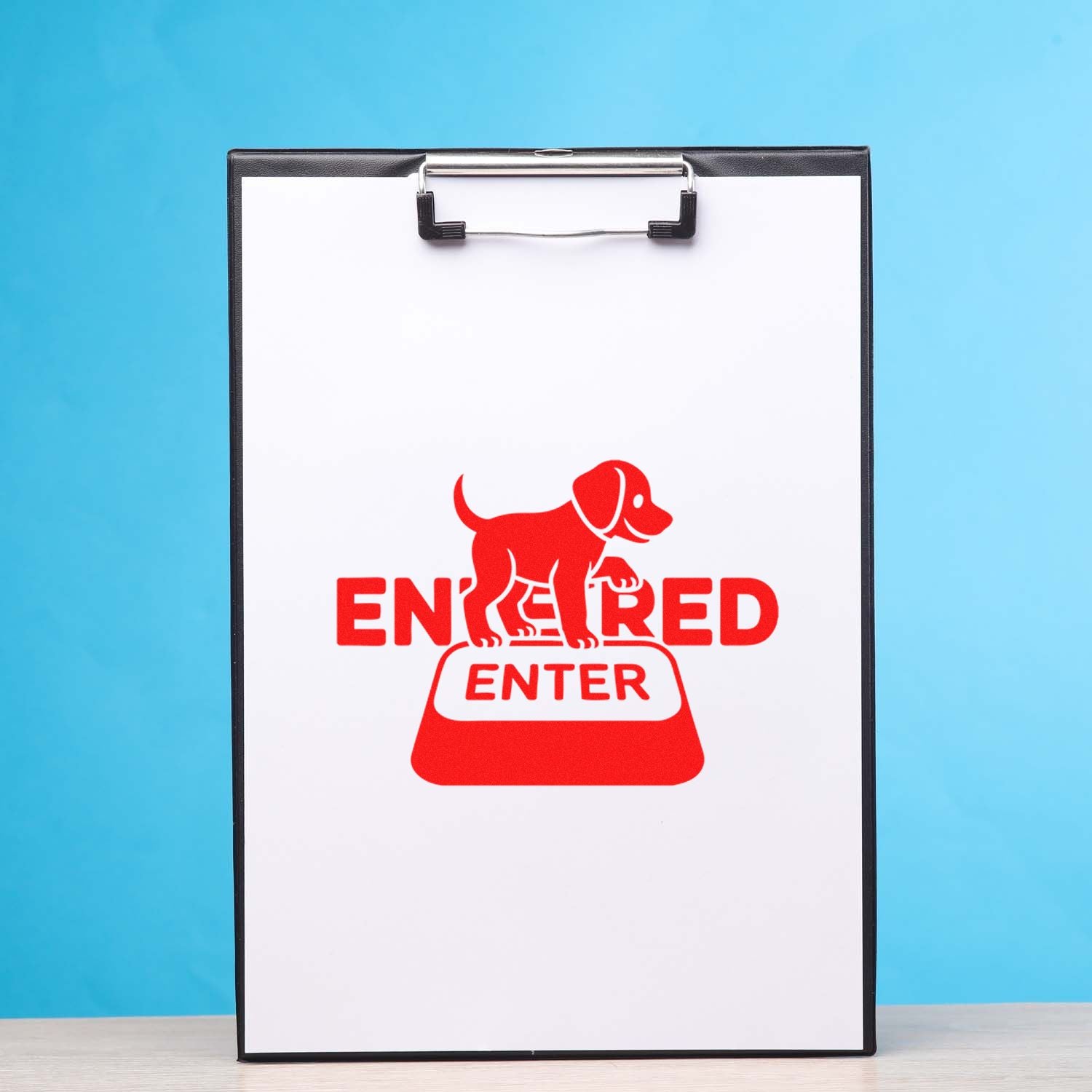 Red ENTERED rubber stamp design with dog icon on clipboard for office document marking.