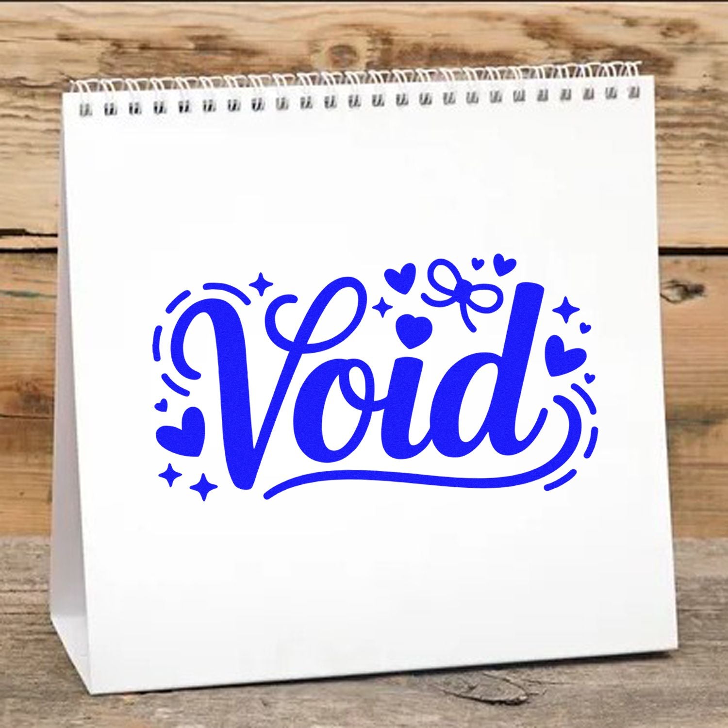 Blue Void rubber stamp design with hearts and stars on a white paper gift bag mockup.