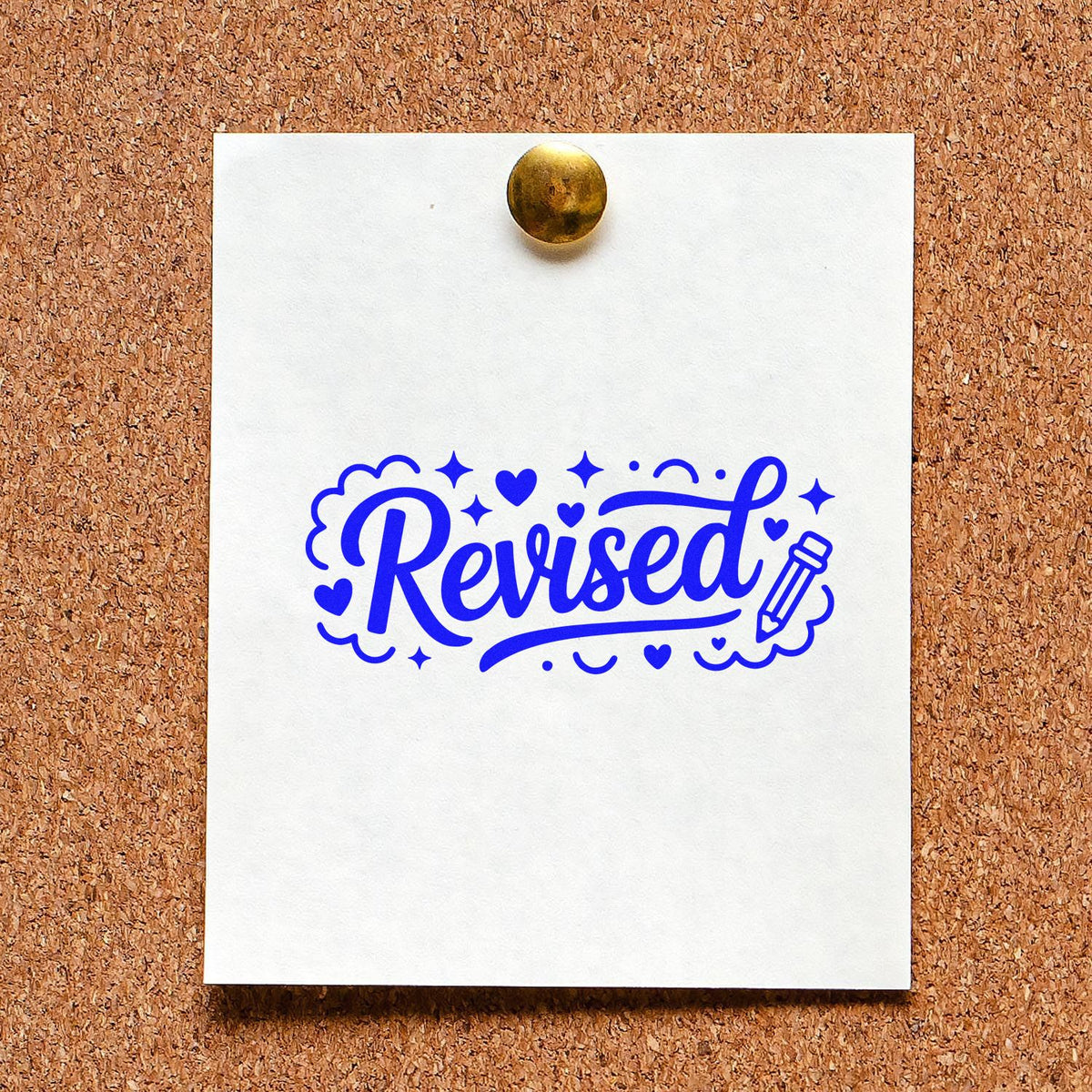 Blue revised rubber stamp imprint on paper pinned to corkboard for document review and approval.