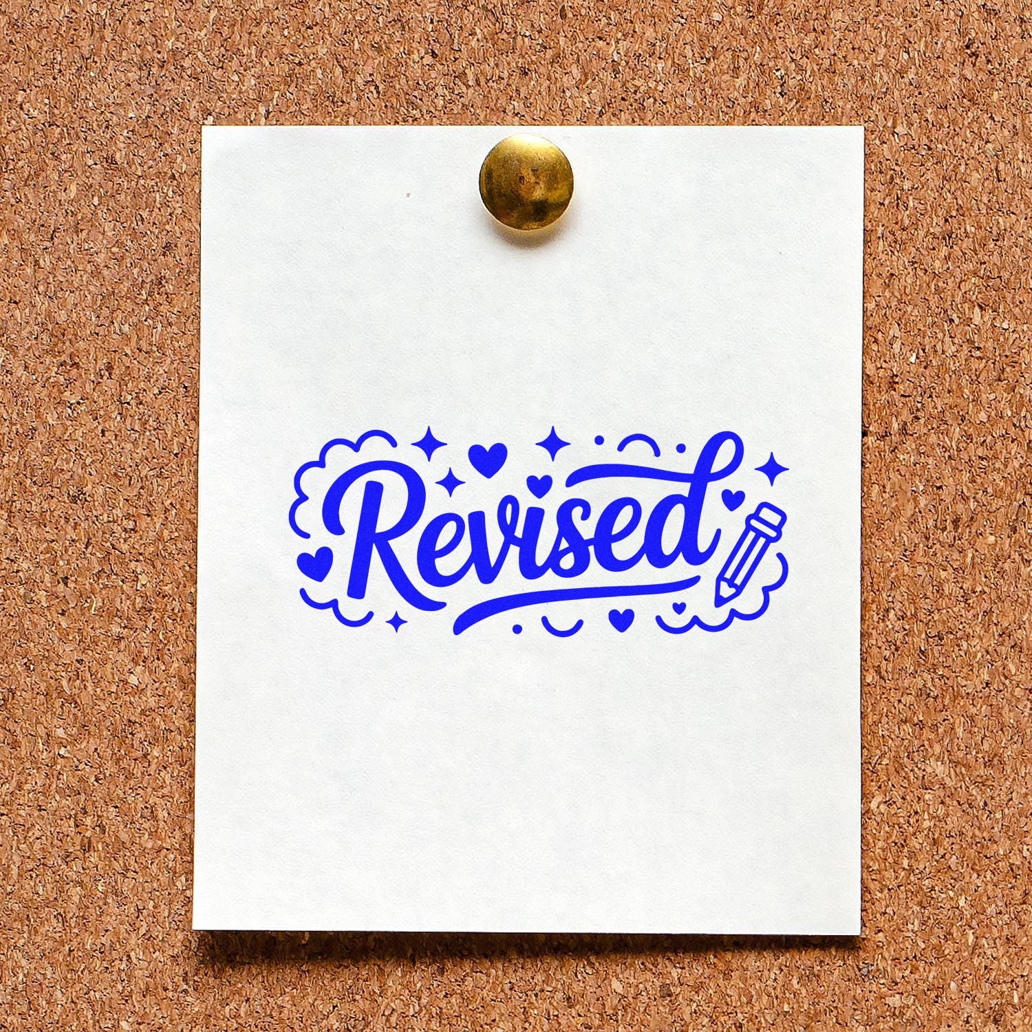 Blue Revised rubber stamp design on pinned paper, ideal for office document marking, teacher use, and workflow approval.