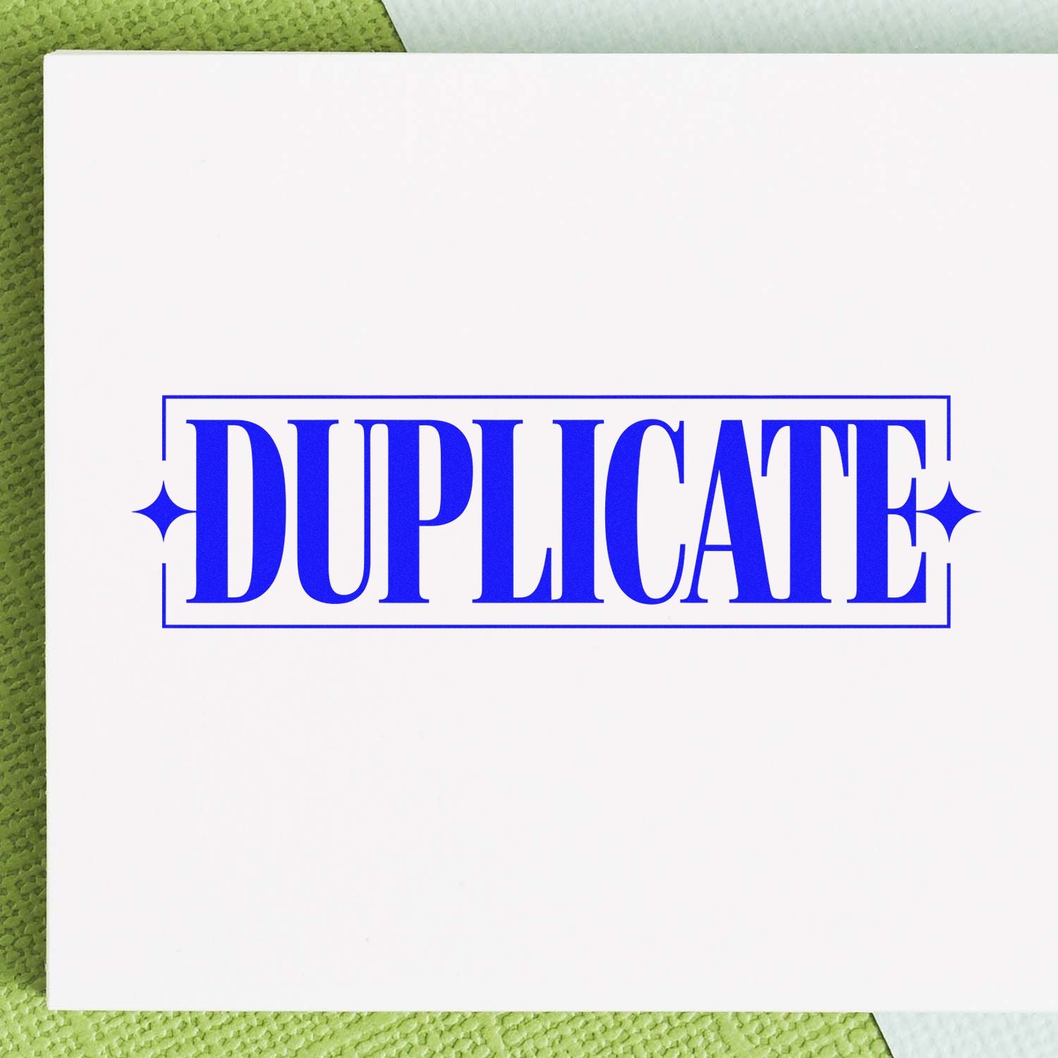 Bold blue DUPLICATE rubber stamp design for office document marking, file organization, and duplicate copy labeling.