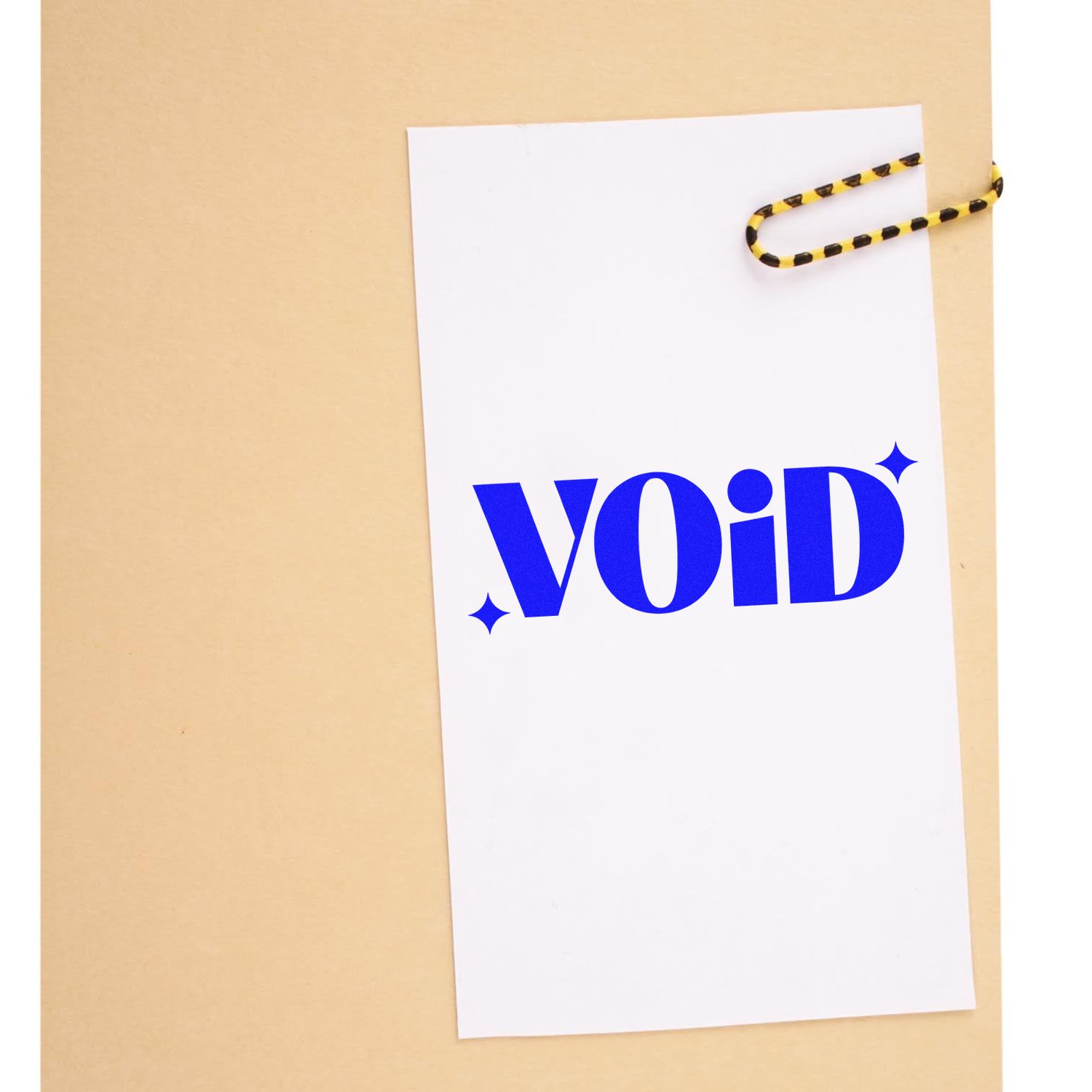 VOID office rubber stamp design on clipped white paper, ideal for document marking and file processing.