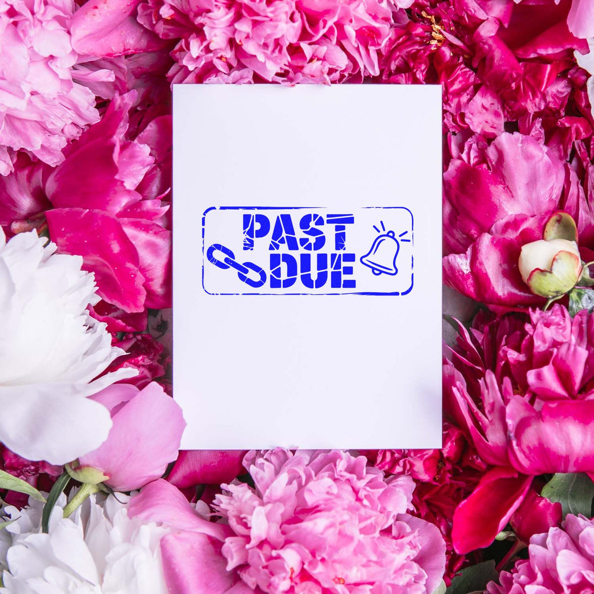 Past Due rubber stamp impression on white card, styled for late payment notices, surrounded by pink flowers.