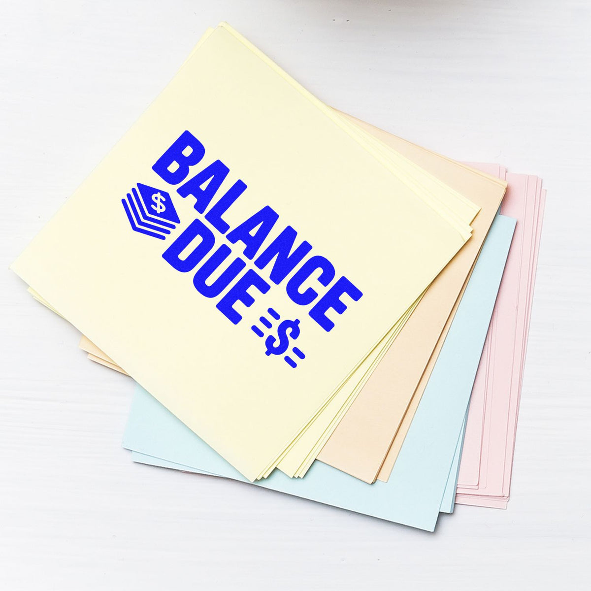 Balance Due rubber stamp on pastel invoice forms, ideal for billing, accounting, and payment reminder documents