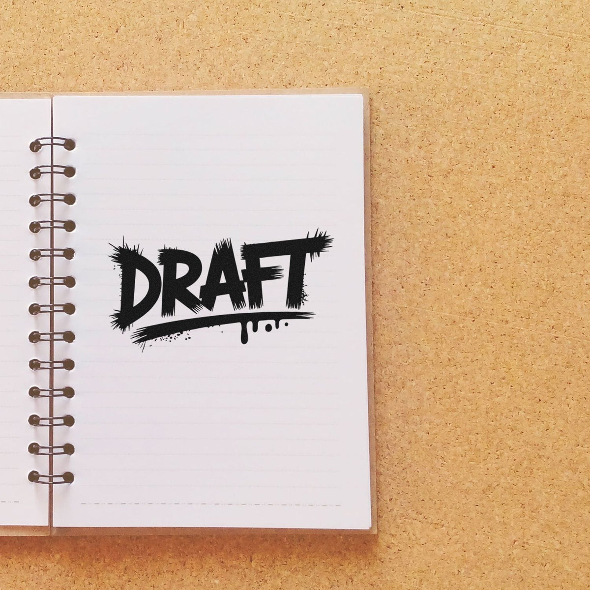 Draft rubber stamp imprint on a notebook page, ideal for marking documents, notes, and work-in-progress projects.