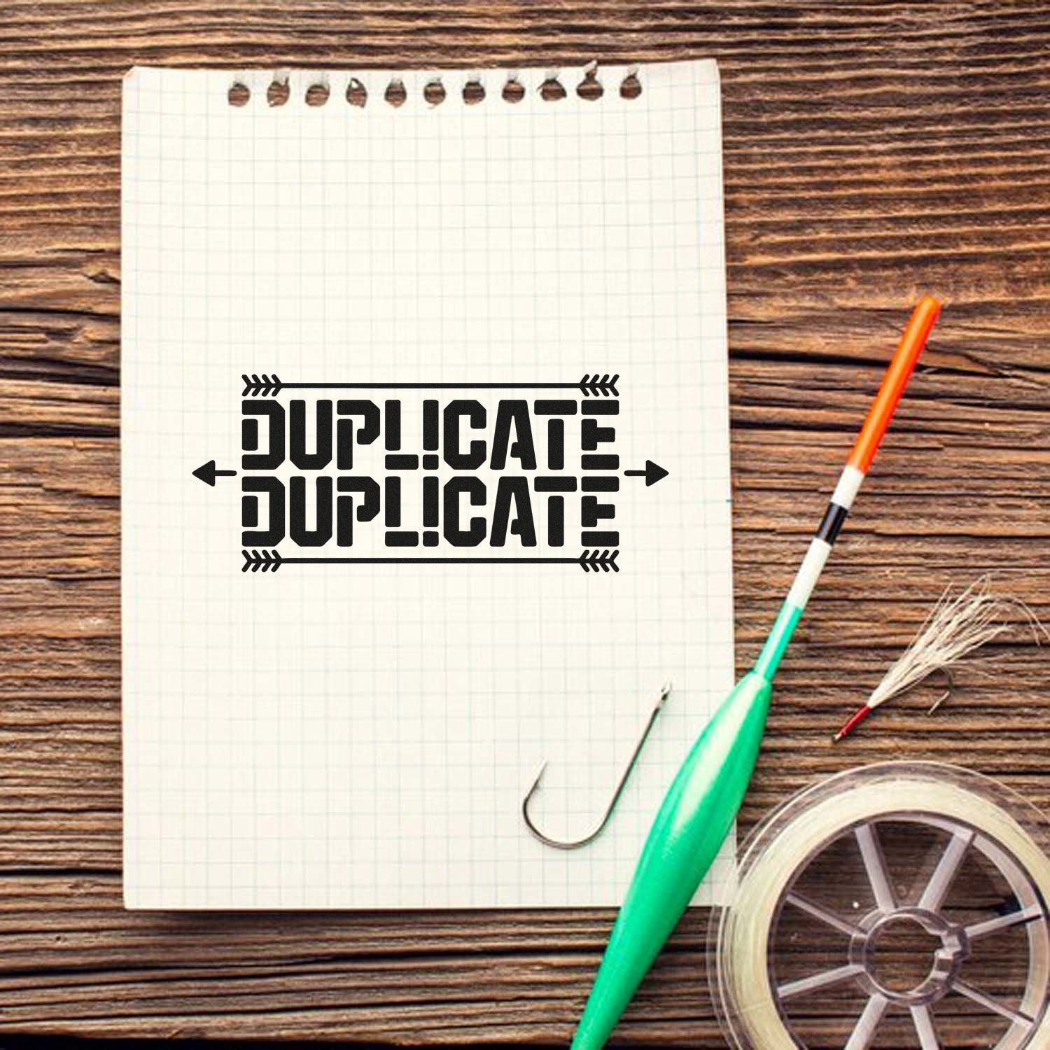 Custom duplicate rubber stamp imprint on notebook, ideal for marking copies on office documents and craft projects.