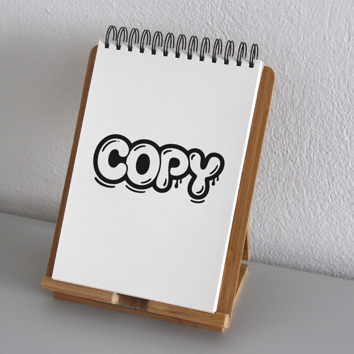 Copy rubber stamp imprint on notepad, ideal for marking document duplicates in office and stationery use.