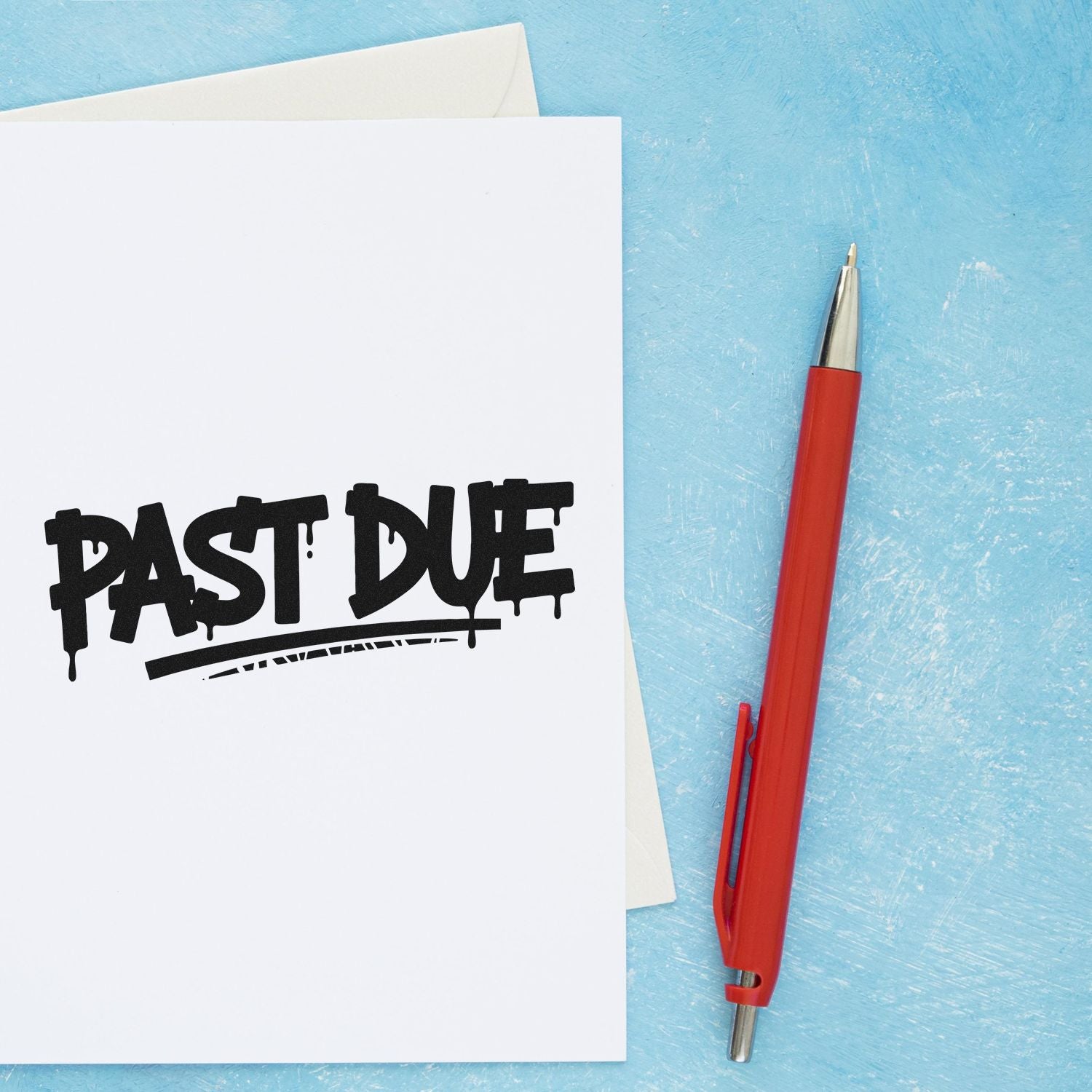 Past Due rubber stamp impression on white paper beside red pen, ideal for overdue billing and office paperwork.