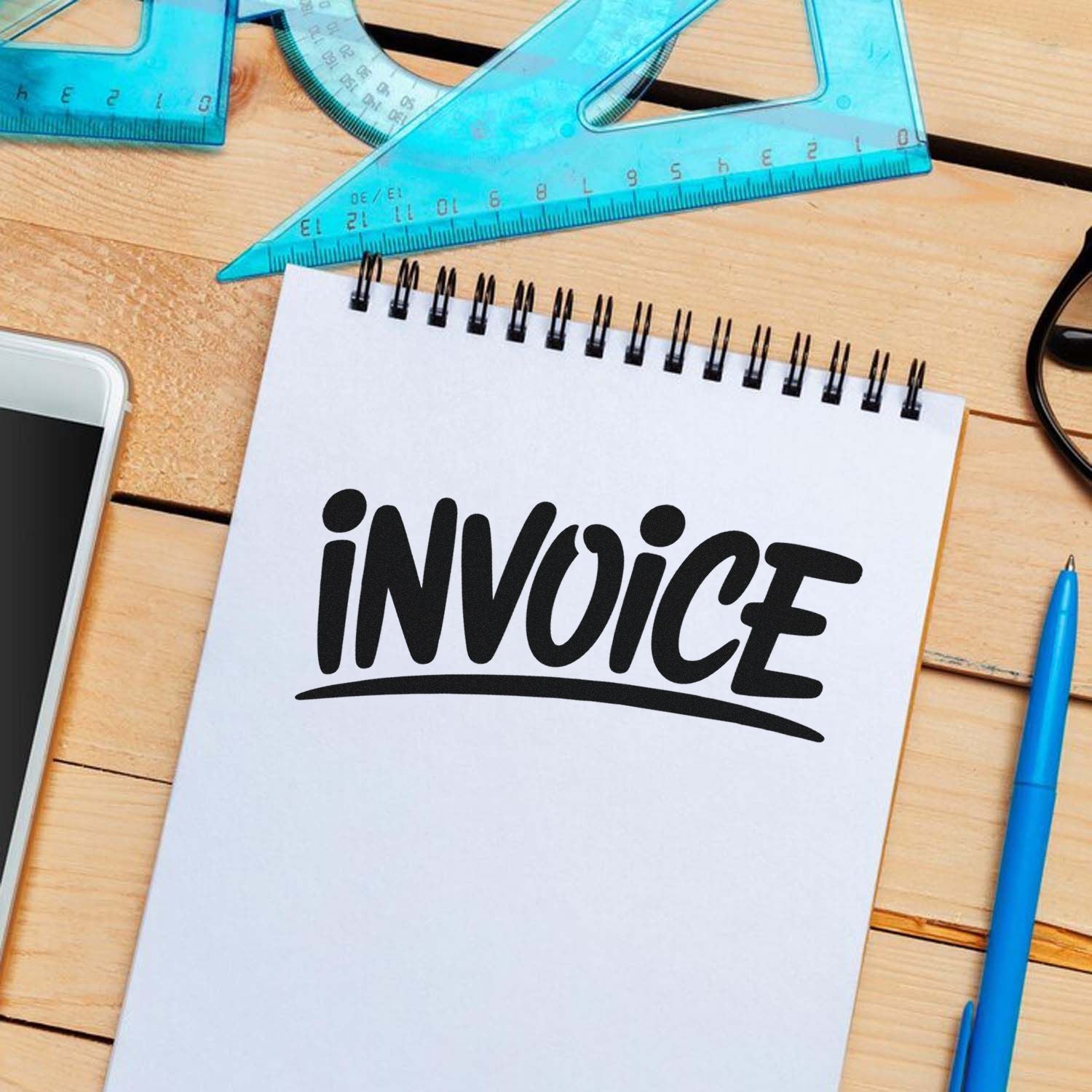 Invoice stamp design on notepad for billing, accounting, and office paperwork.