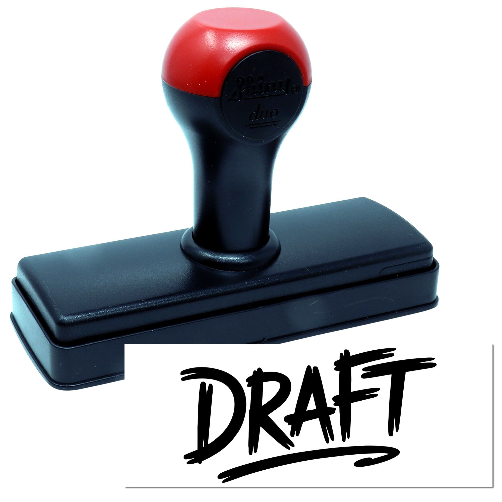 Self-inking rubber stamp with DRAFT imprint for office document review and approval marking.