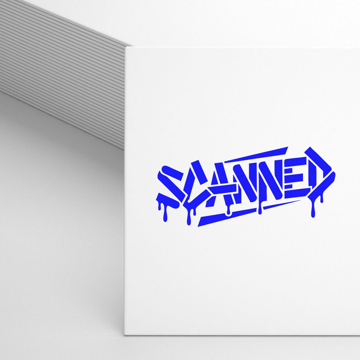 Blue graffiti-style SAME rubber stamp impression on a white notebook cover, ideal for custom street-art stamping.