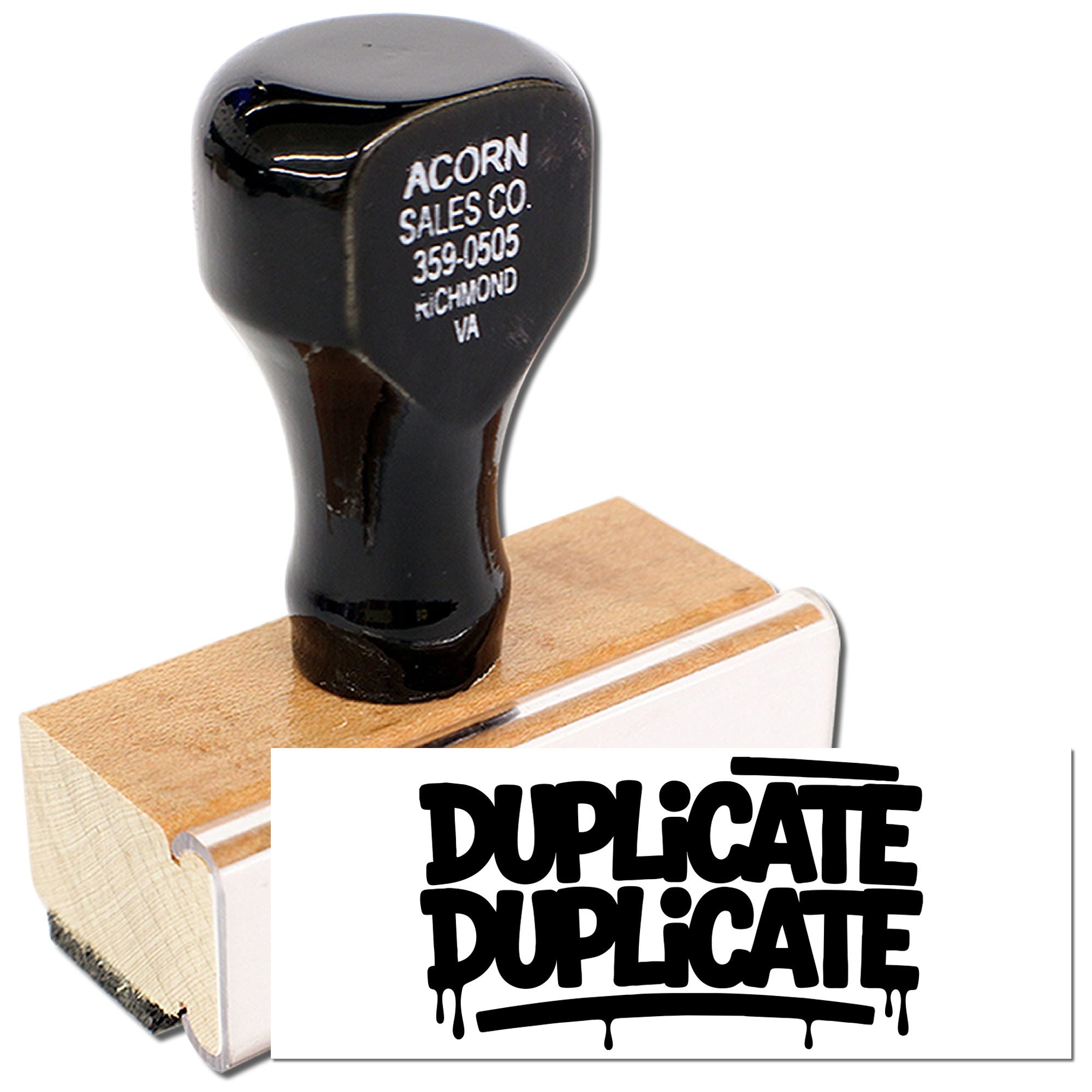 Duplicate rubber stamp with black handle and wood base for marking copies on office documents and records.