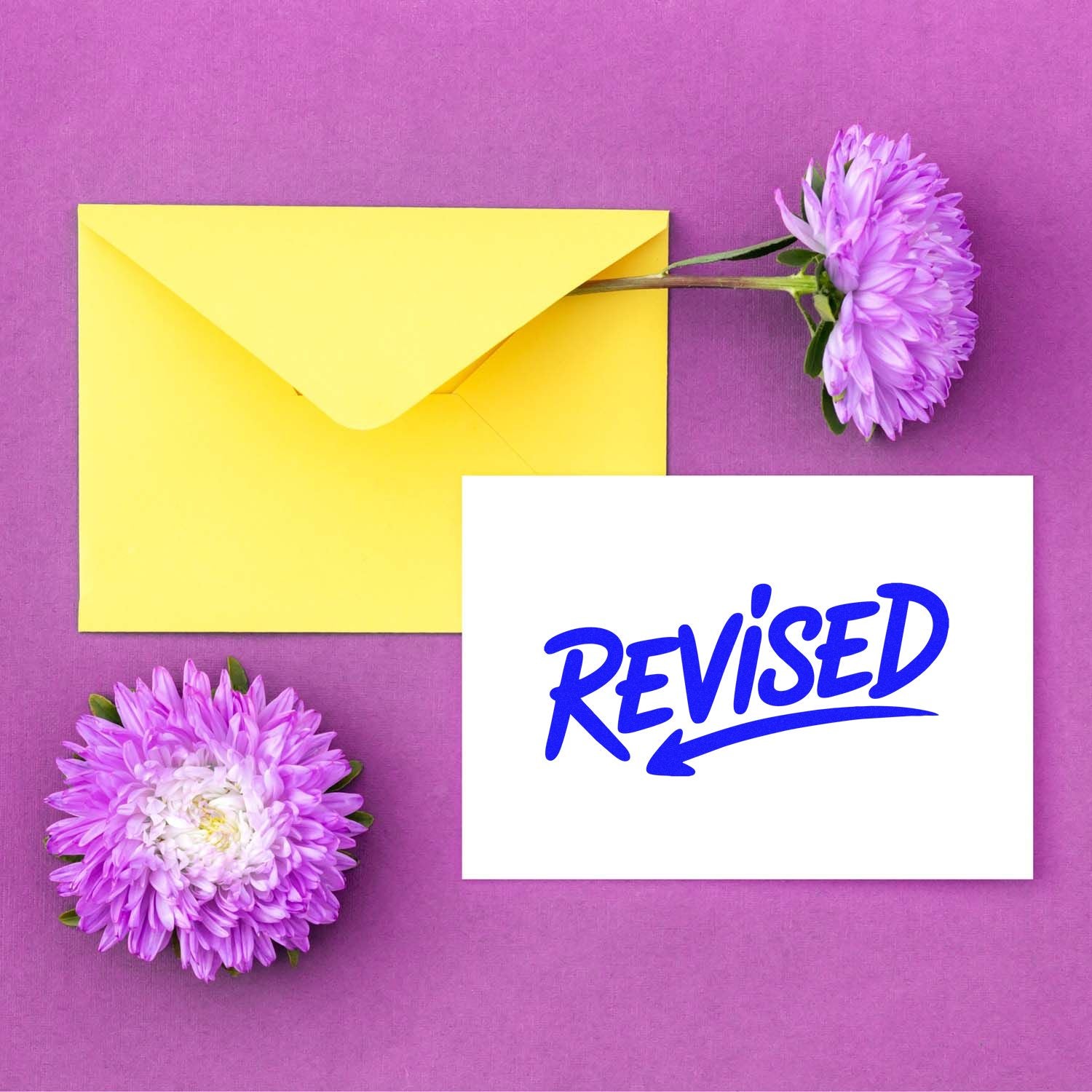Blue Revised rubber stamp design for marking edited documents, approvals, and office paperwork.