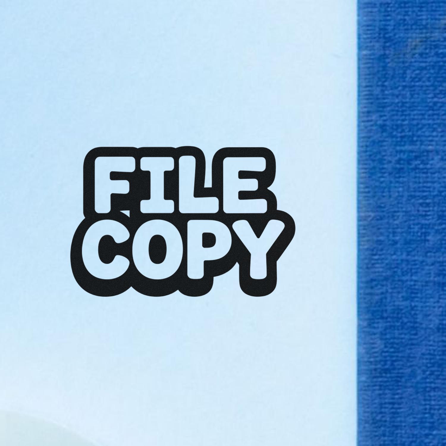 File Copy rubber stamp impression on paper, bold black office document marking for records and filing.