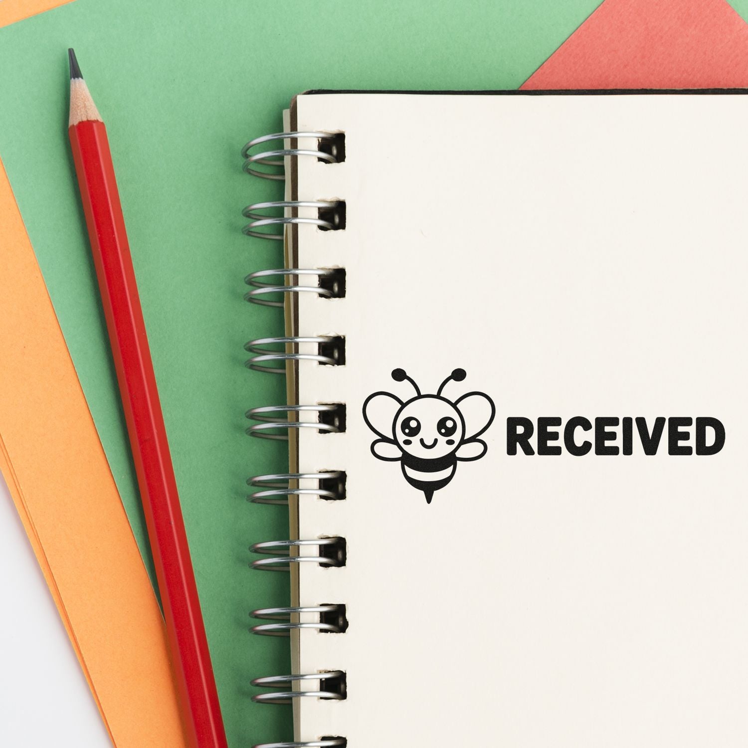 Custom bee received rubber stamp on notebook for school or office paperwork.